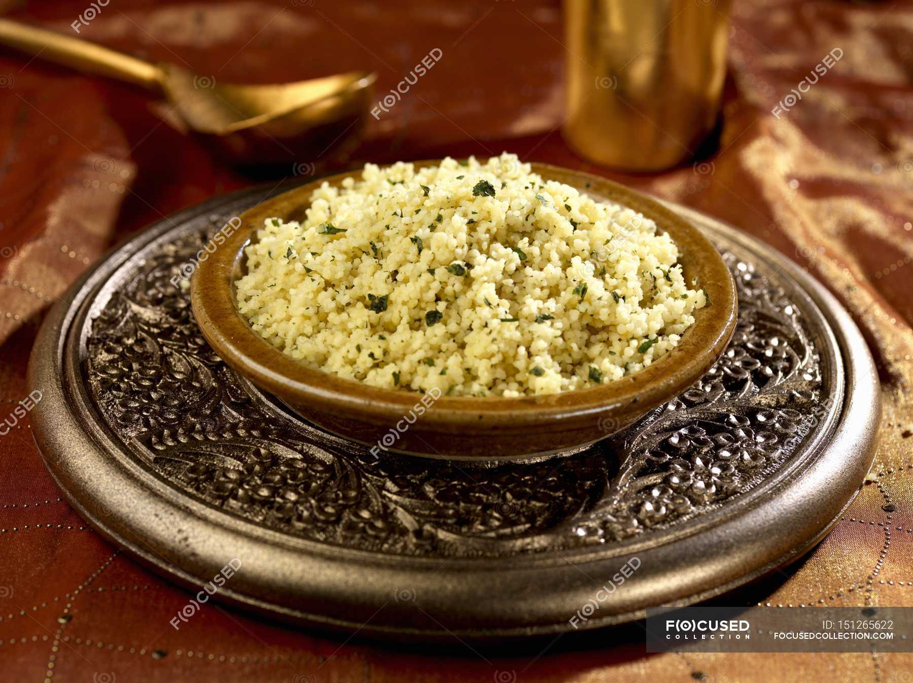 Closeup view of coriander with lemon and cous cous — food, flavour