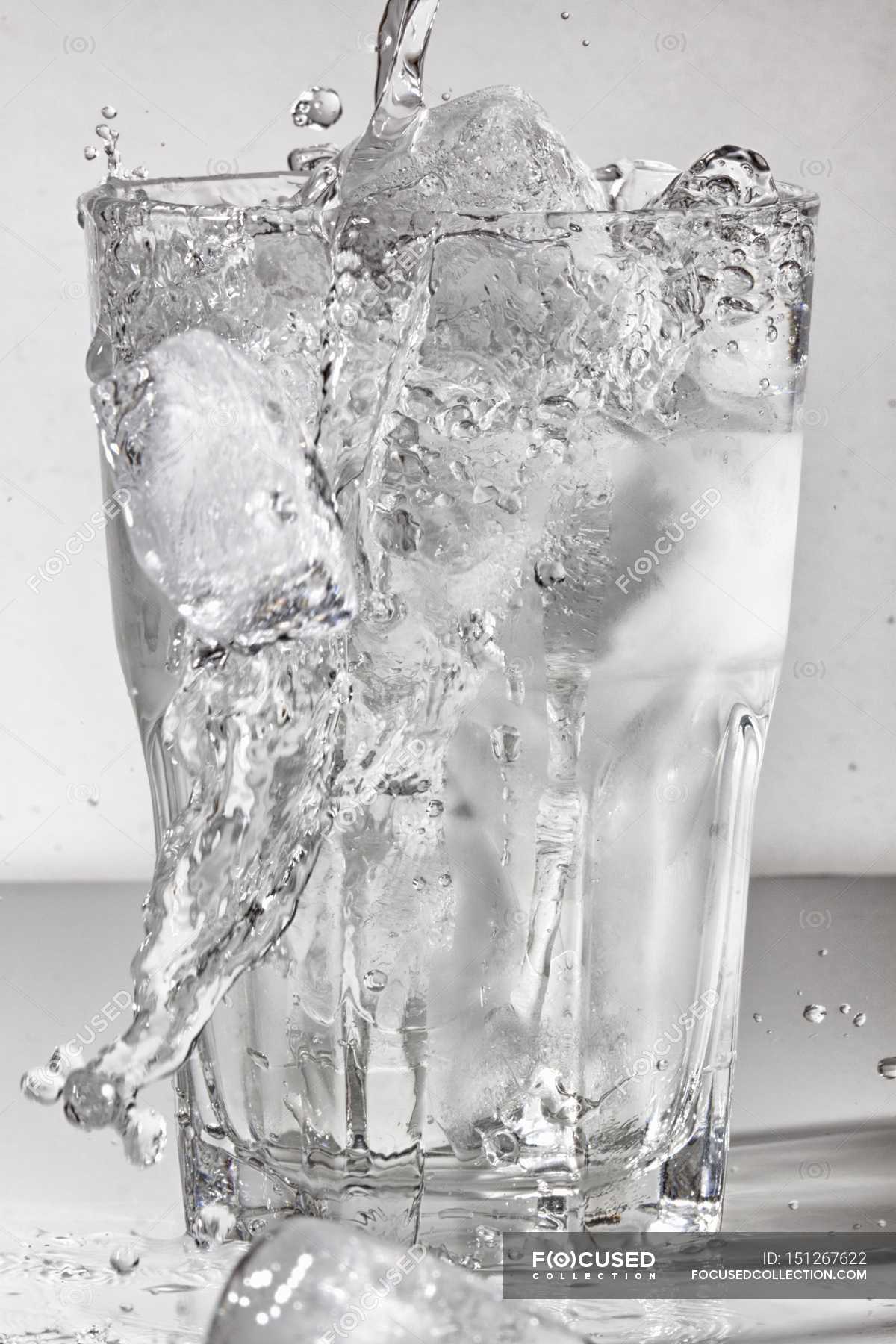 Water Poured Into Glass Of Ice — Cubes White Stock Photo 151267622