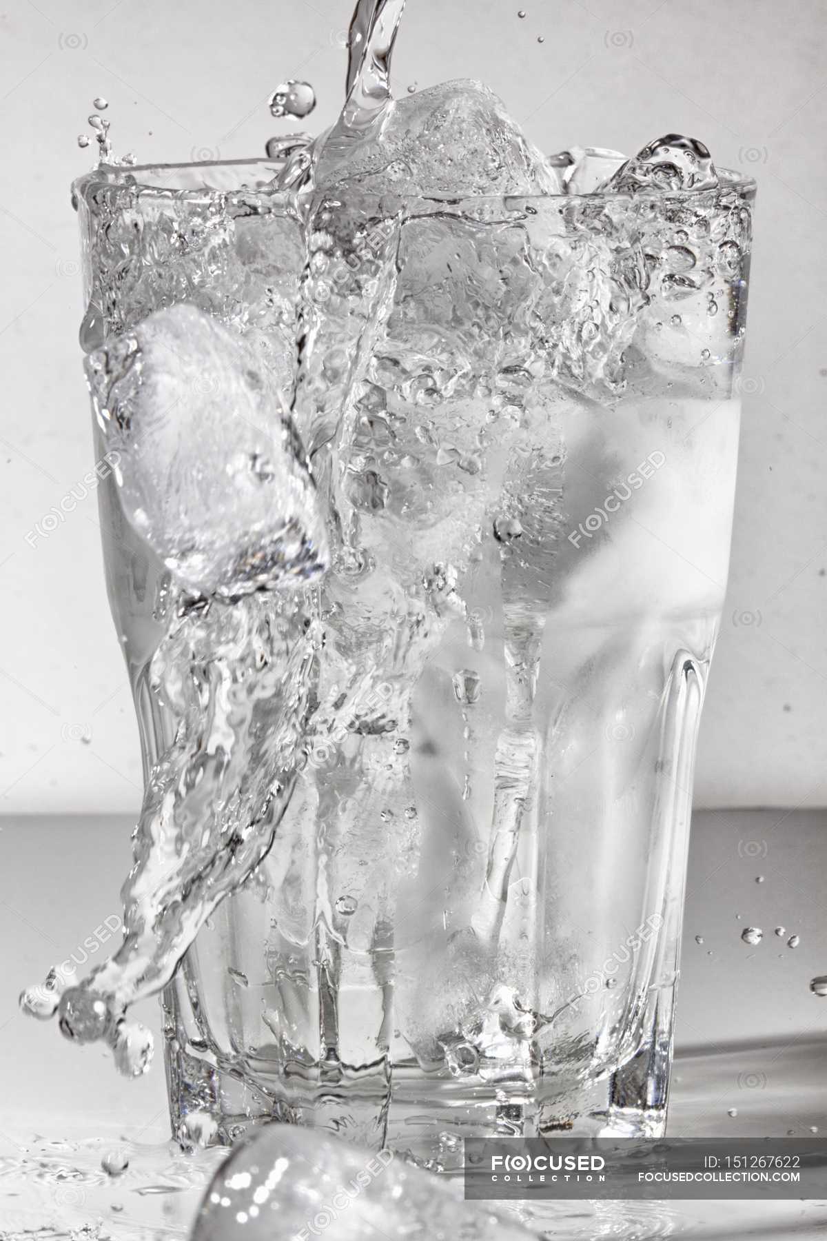 Water Poured Into Glass Of Ice Cubes White Stock Photo 151267622
