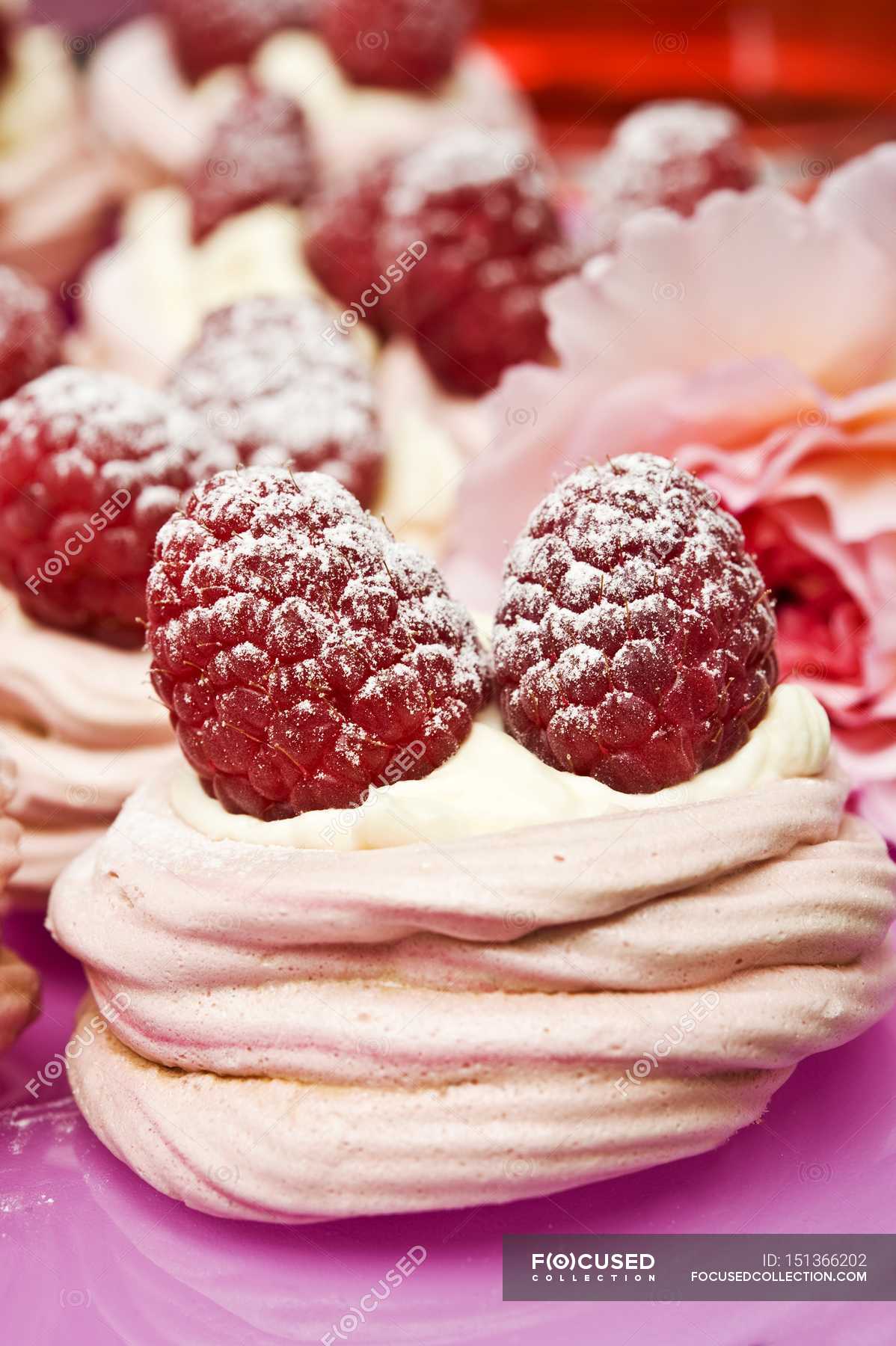 Pink meringues with cream — sweetness, baked - Stock Photo | #151366202