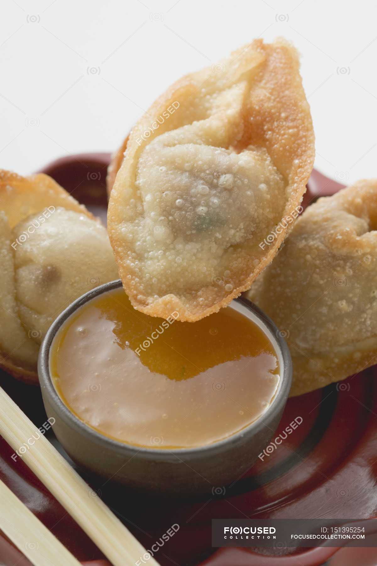 Deepfried dim sum and sauce — close up, sweet sour Stock Photo
