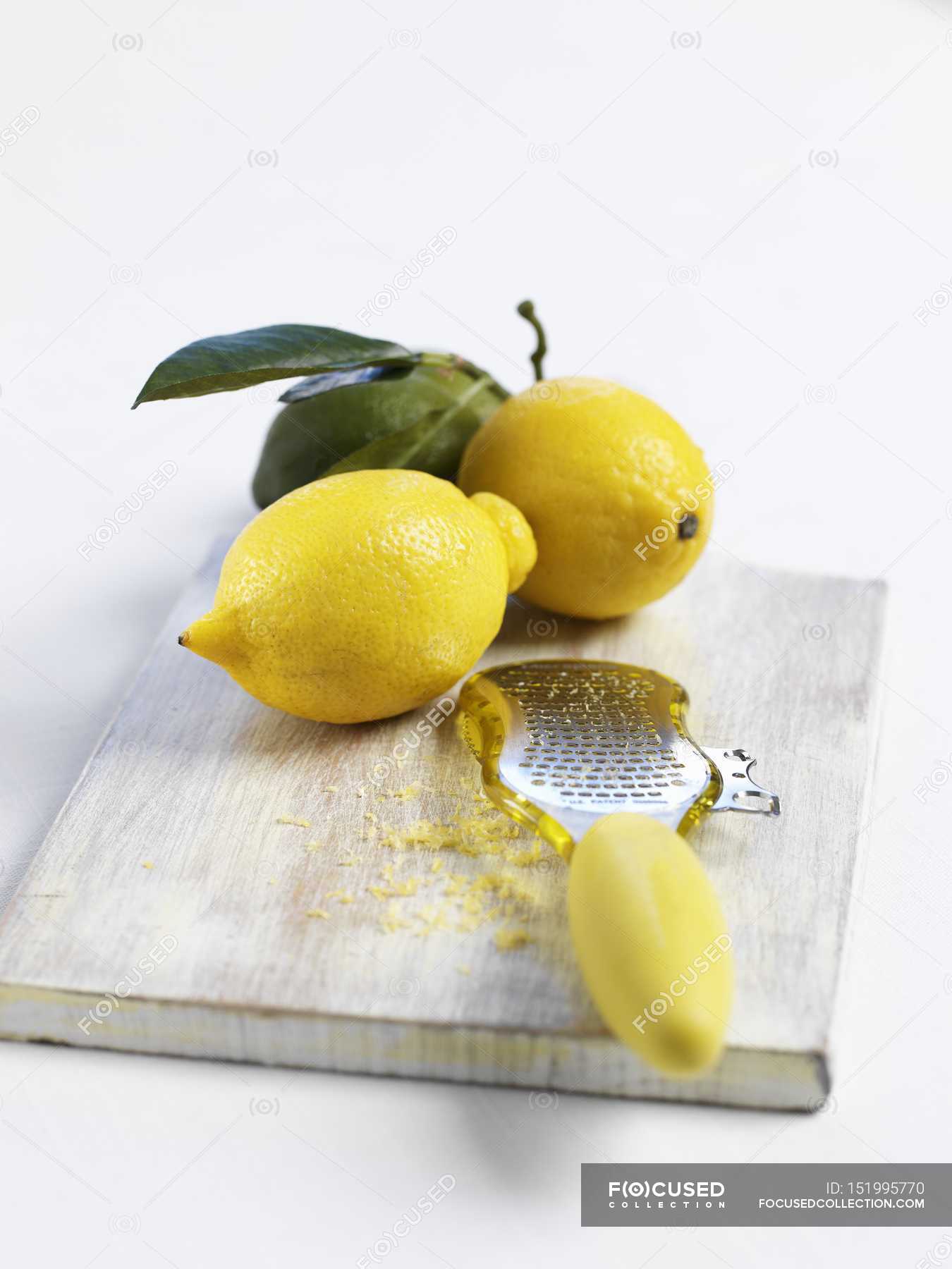 Lemons with grater and lemon zest — clean eating, daylight Stock