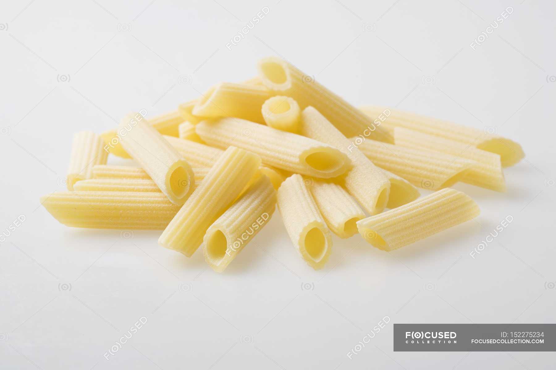 Pile of fresh Penne Rigate pasta — delicious, indoors - Stock Photo |  #152275234