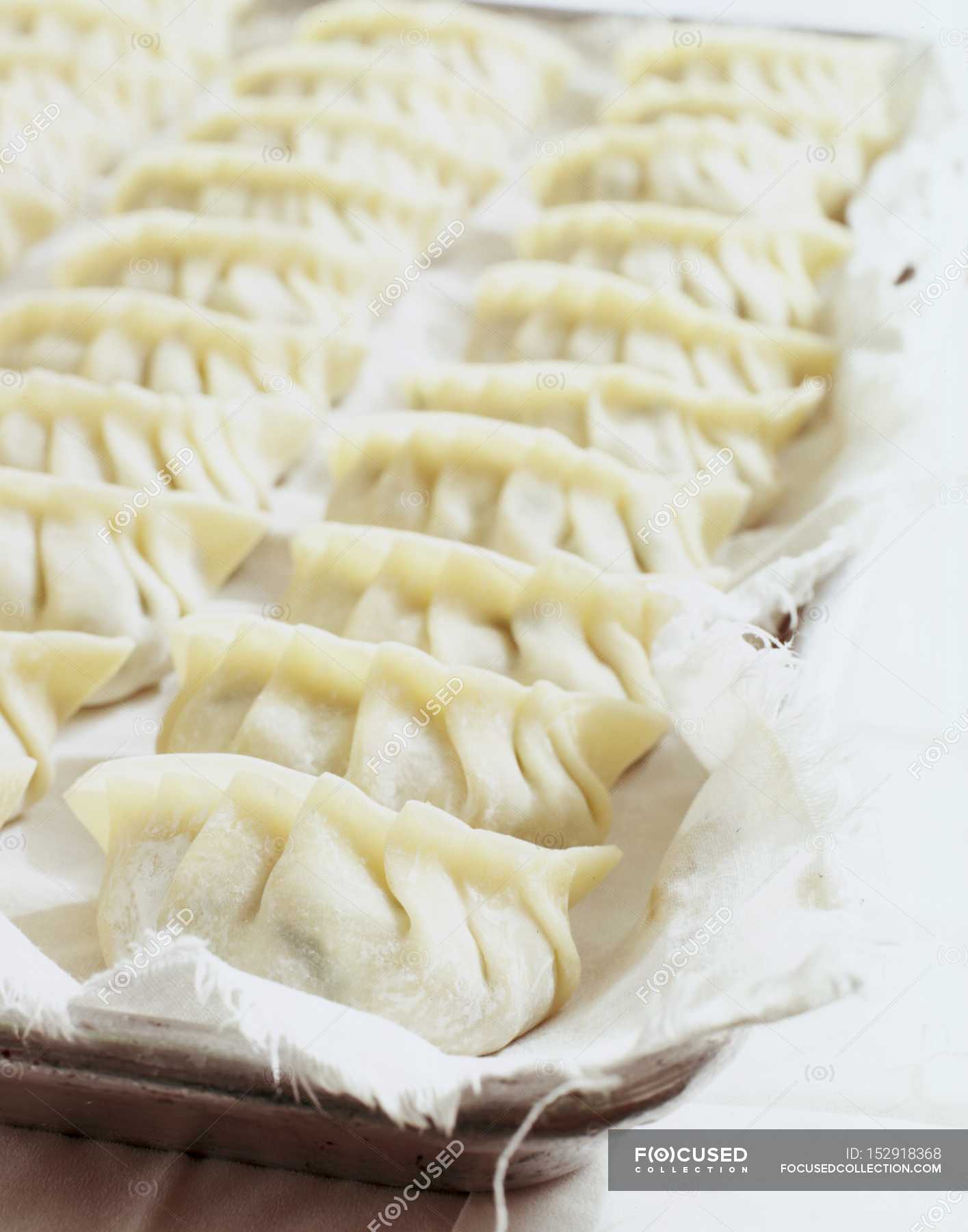 Raw pasta parcels — Ready To Eat, staple food - Stock Photo | #152918368