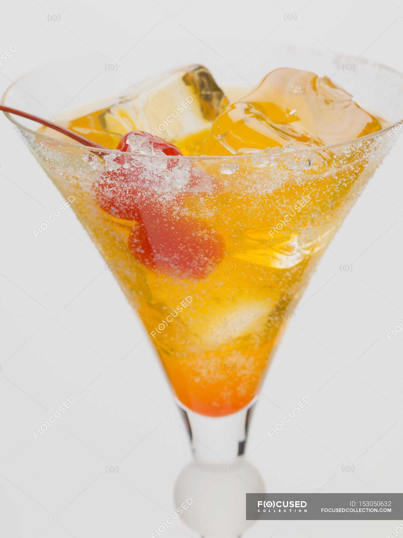 Tequila Sunrise with ice cubes — dish, planting Stock Photo 153050632