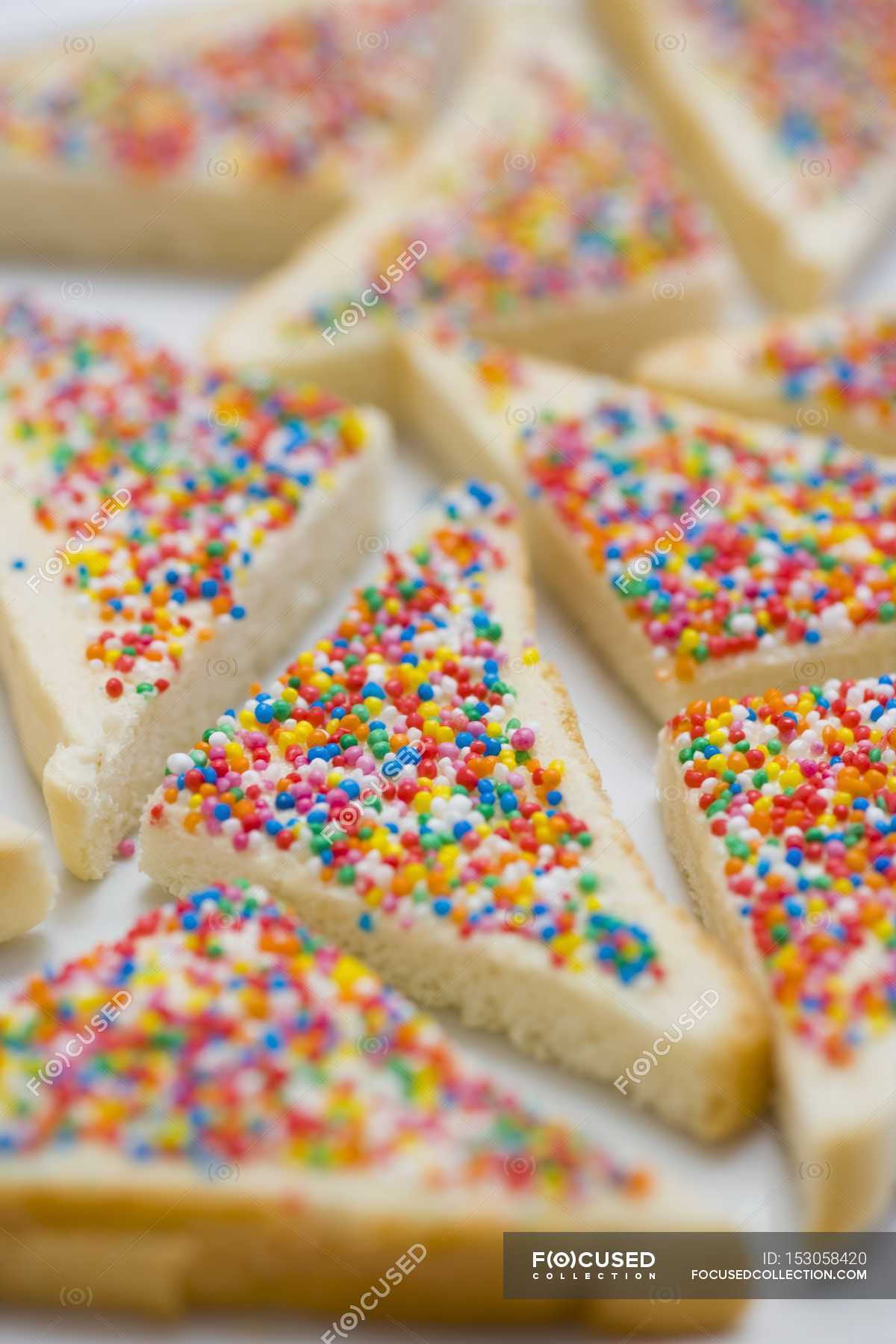 Bread triangles topped with sprinkles — fairy, surface - Stock Photo