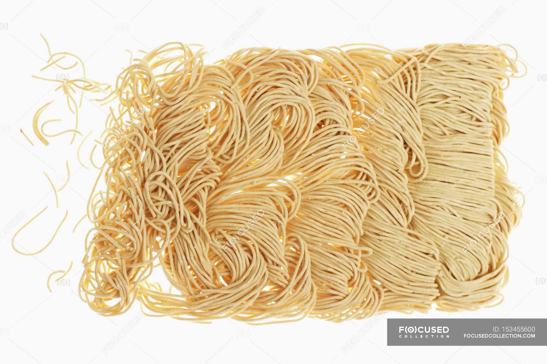 Raw Chinese egg noodles — nutrition, staple food - Stock Photo | #153455600