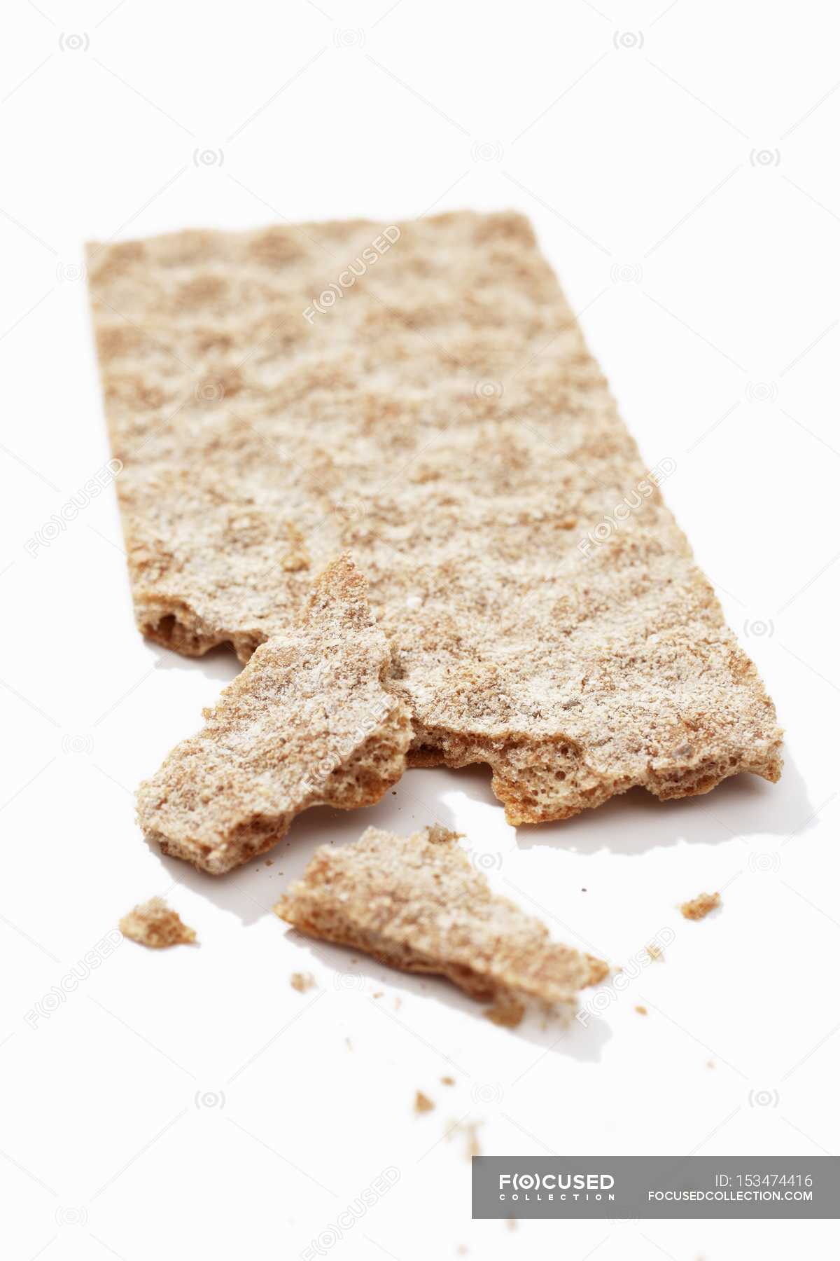 Crackerbread over white surface — snack, broken - Stock Photo | #153474416