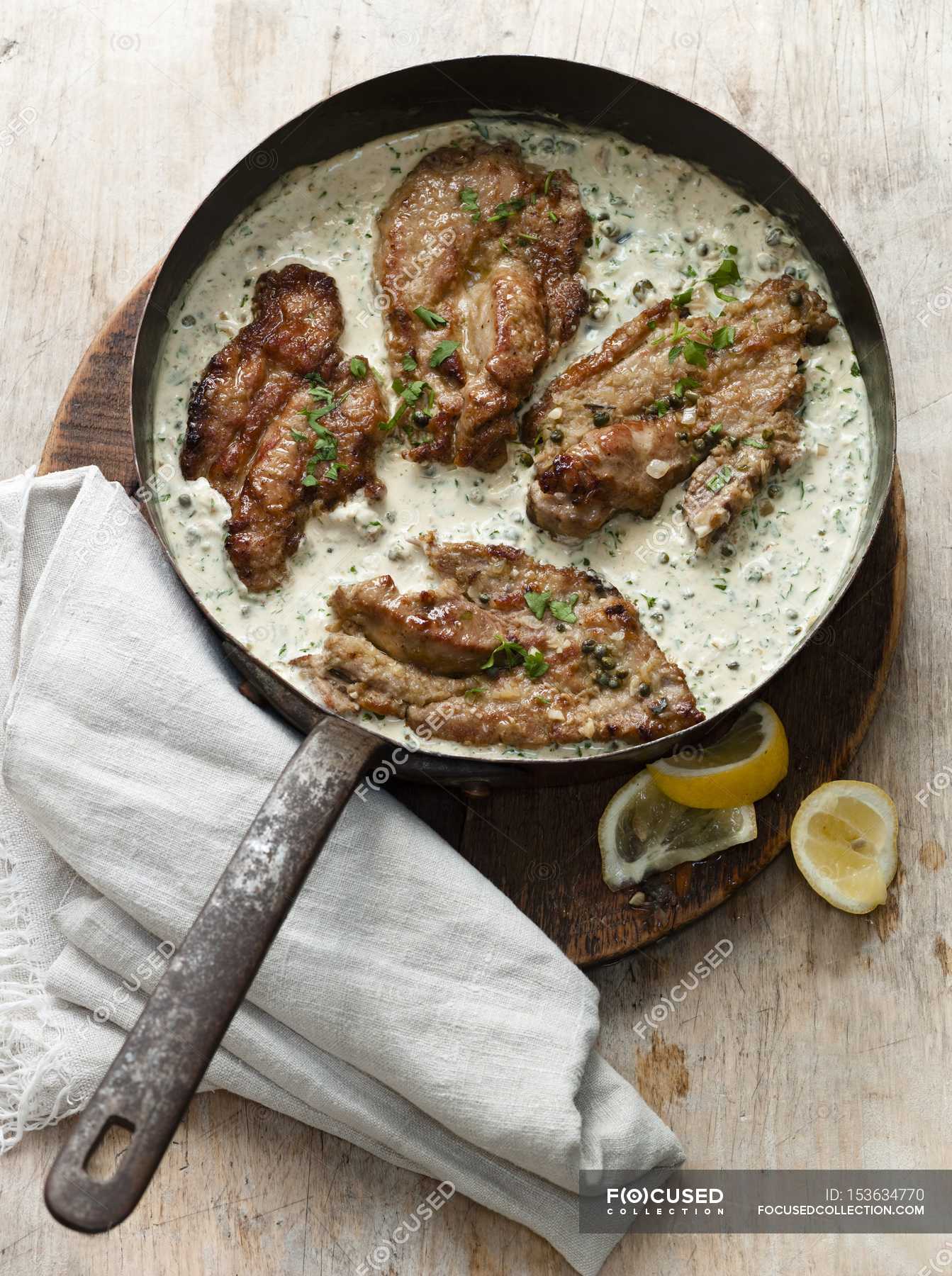 LemonParsley Sauce — food, woden Stock Photo 153634770