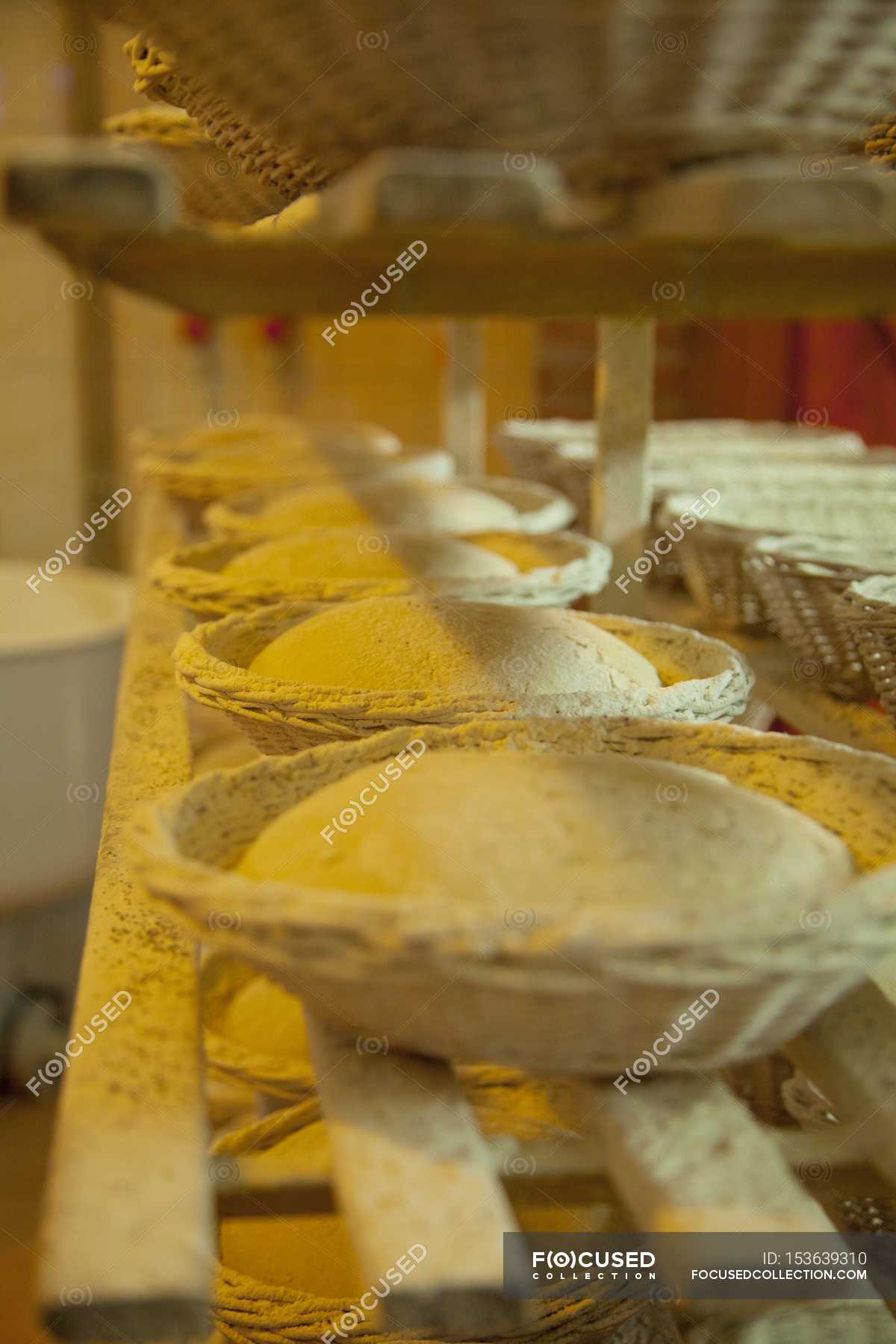 Baking baskets with dough — elements, flour Stock Photo 153639310