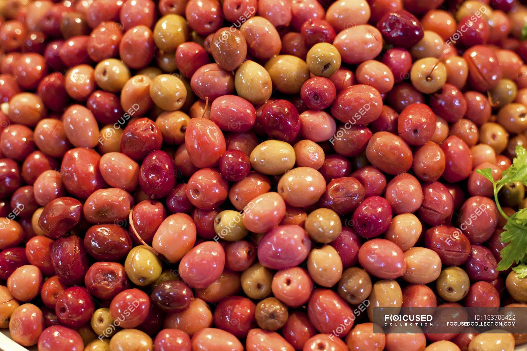 Pickled red olives — delicious, appetizer Stock Photo 153706422