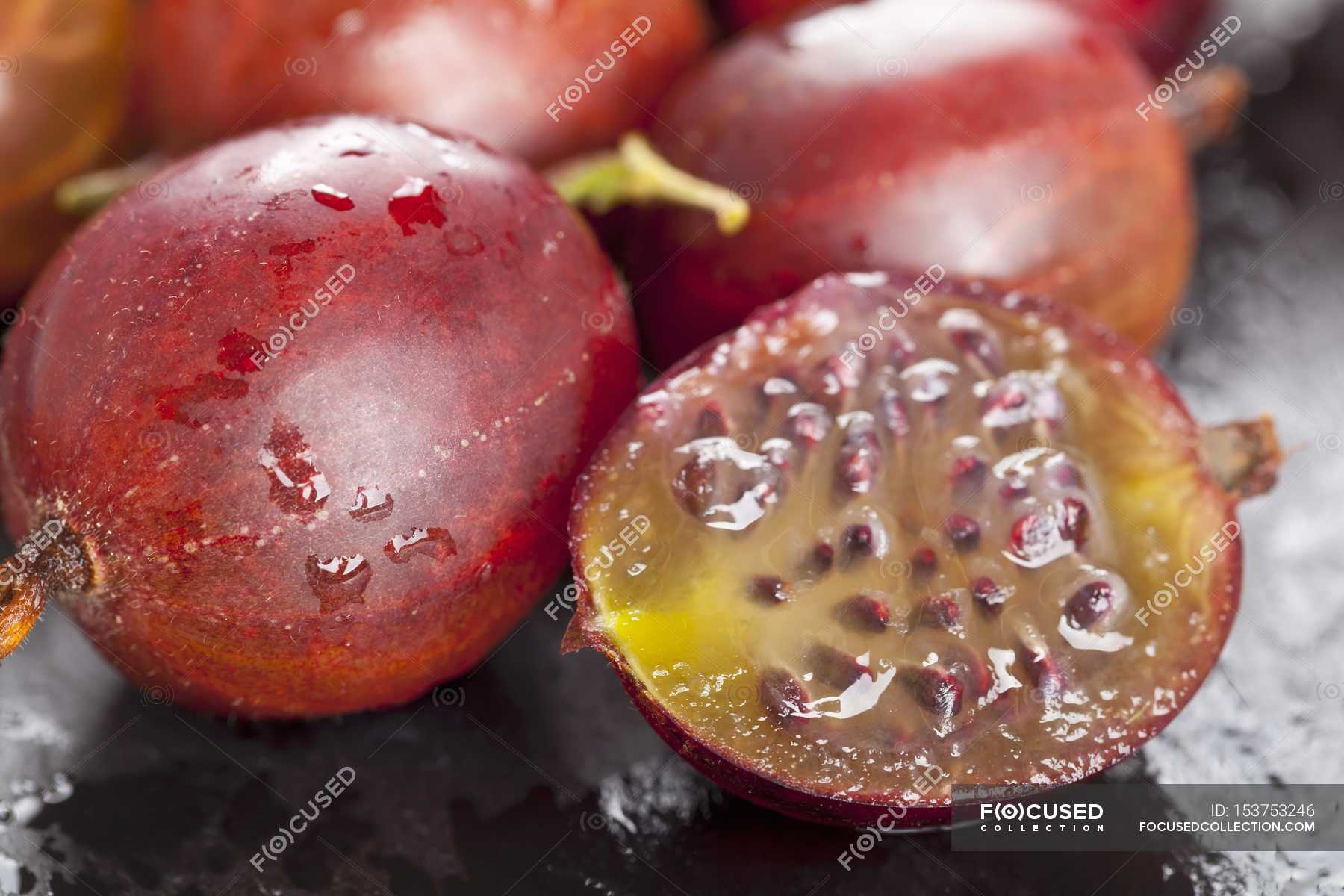 Fresh Red gooseberries with half appetite, unprocessed - Photo | #153753246