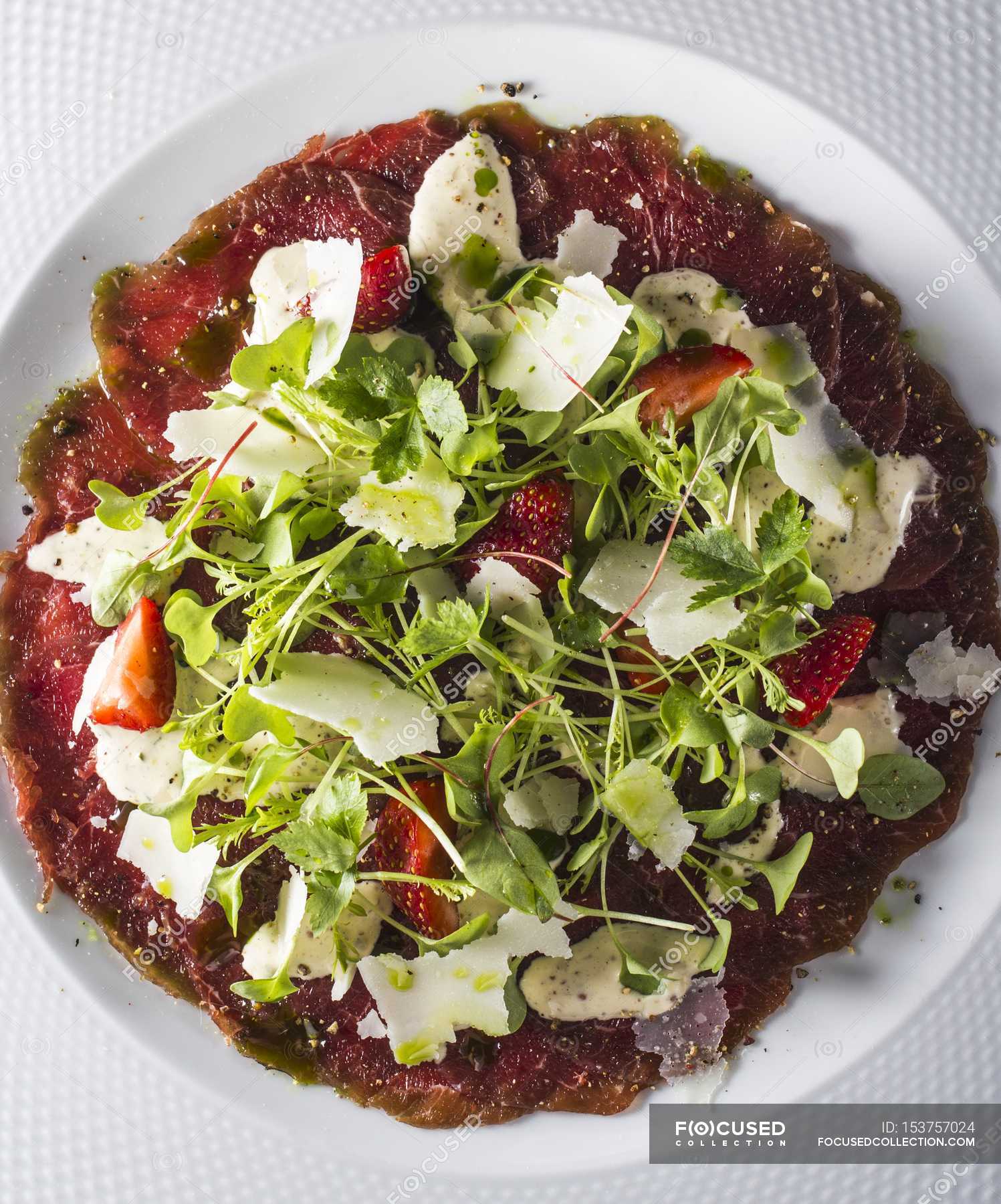 Beef carpaccio with parmesan — tasty, background Stock Photo 153757024
