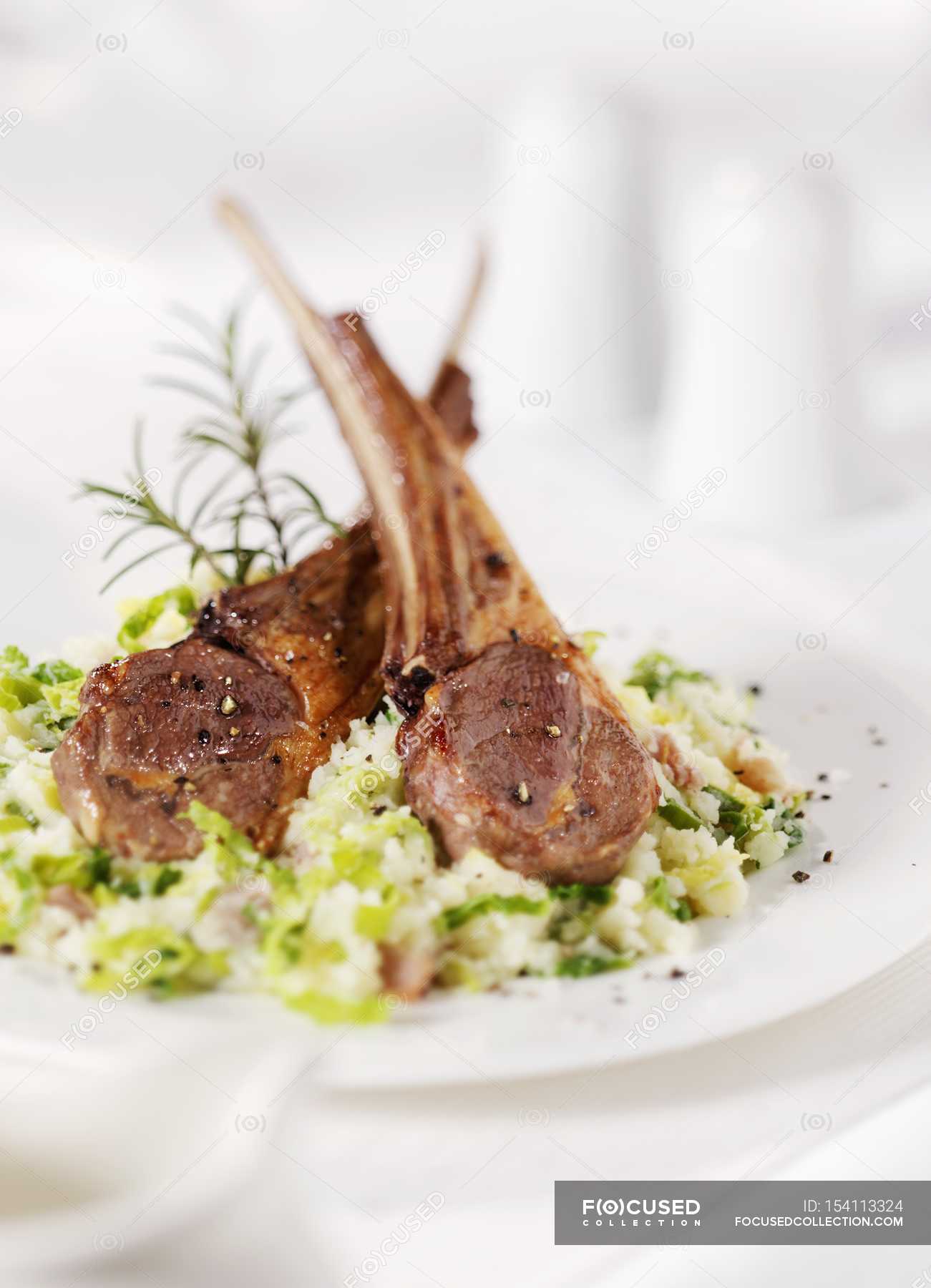 Lamb chops on couscous serving — white, calories - Stock Photo | #154113324