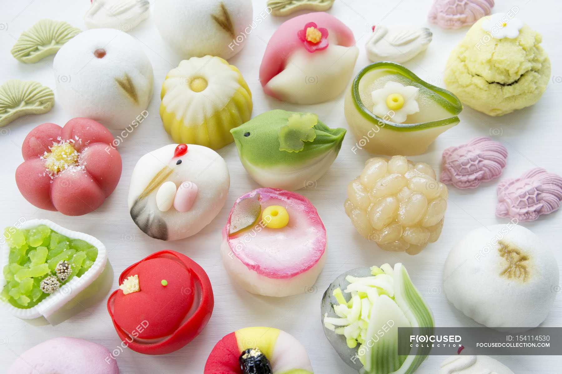 Closeup view of assorted Wagashi on white surface — tasty, background