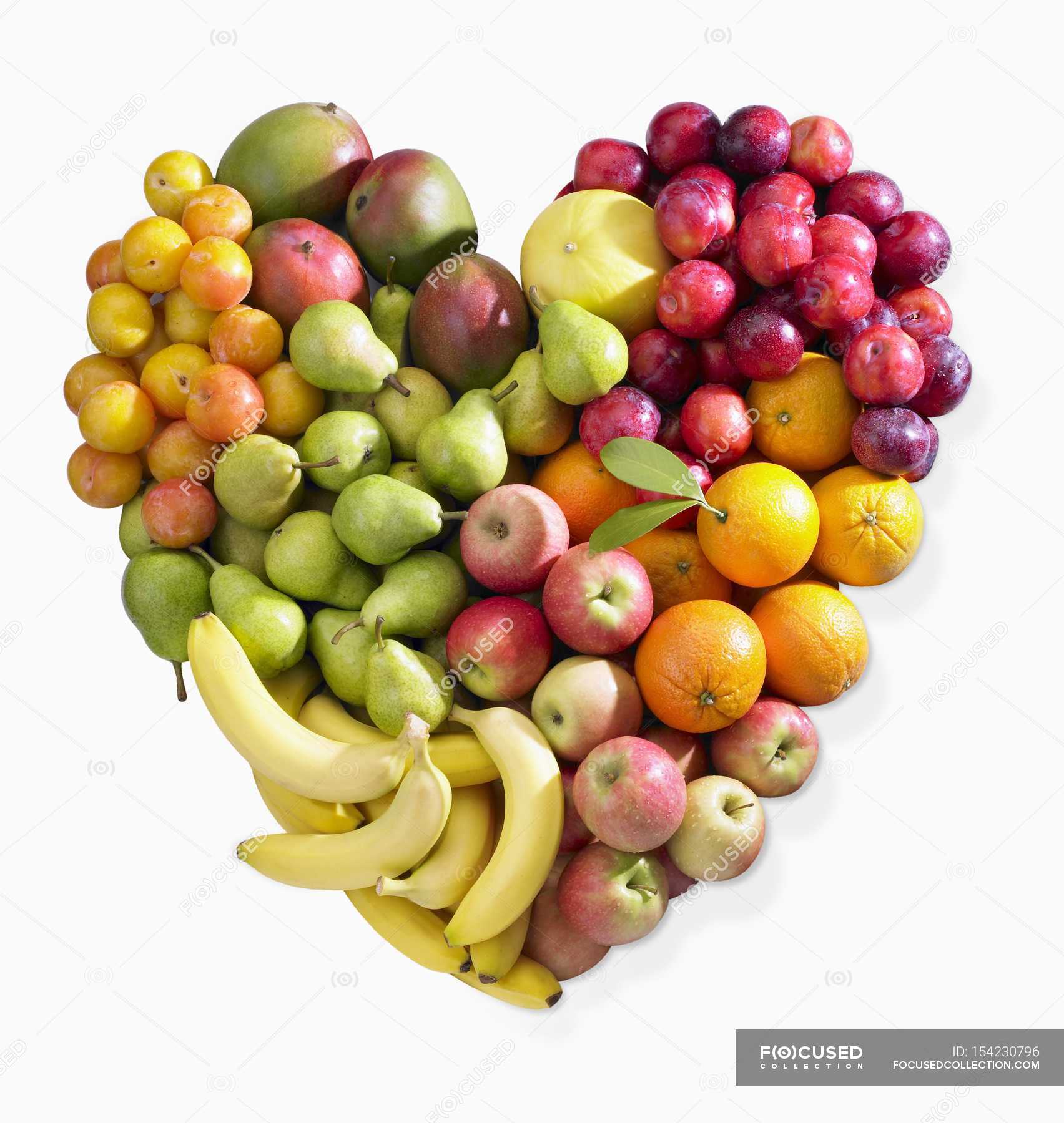 Different Fruits In Heart Shape On White Background Stock Photo Alamy ...