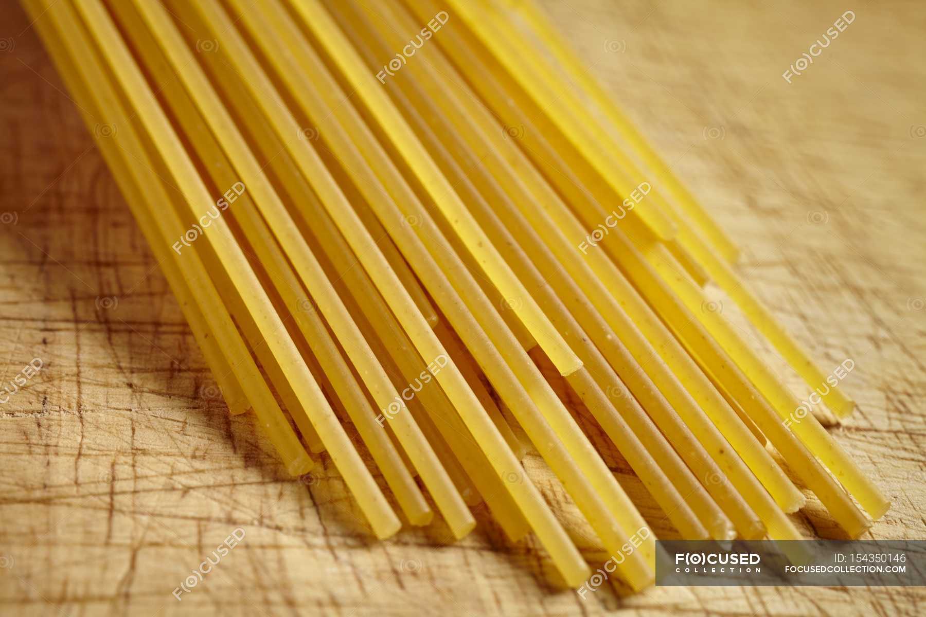 Uncooked spaghetti pasta — tasty, healthy - Stock Photo | #154350146