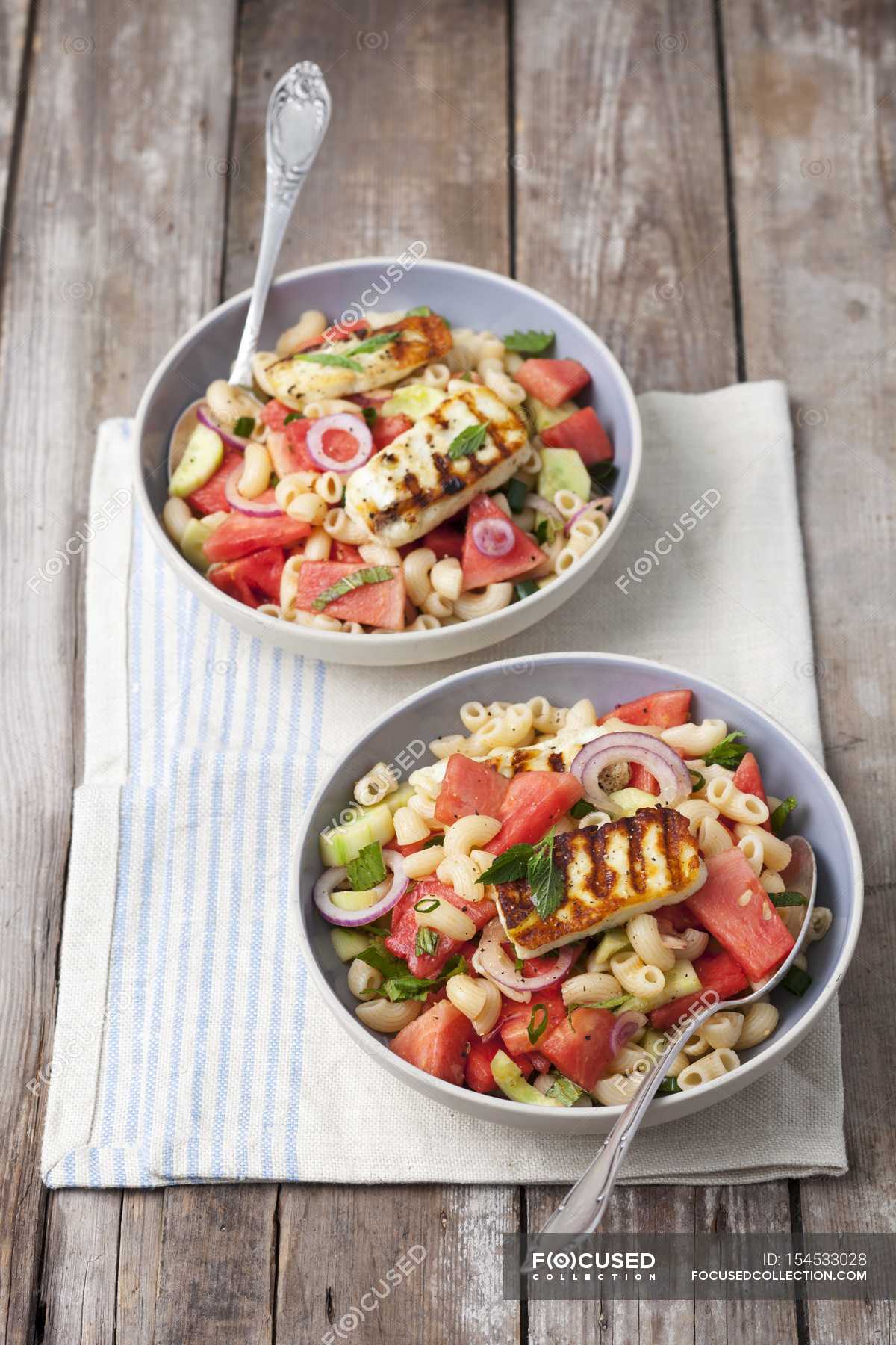 Chifferi pasta salad with watermelon and halloumi — cuisine, appetite -  Stock Photo | #154533028