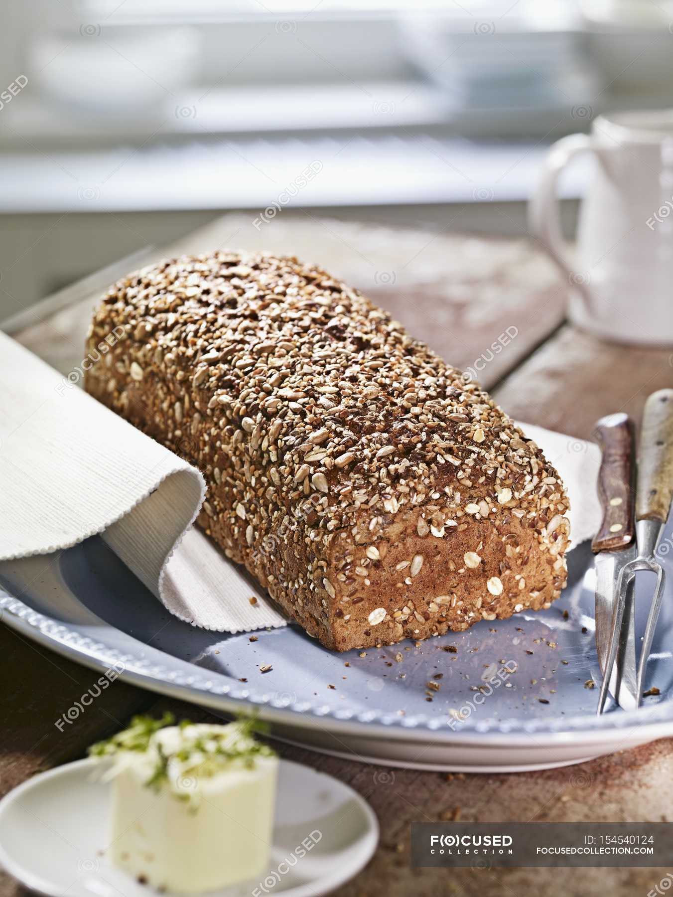 Wholemeal rye bread — fork, plate Stock Photo 154540124