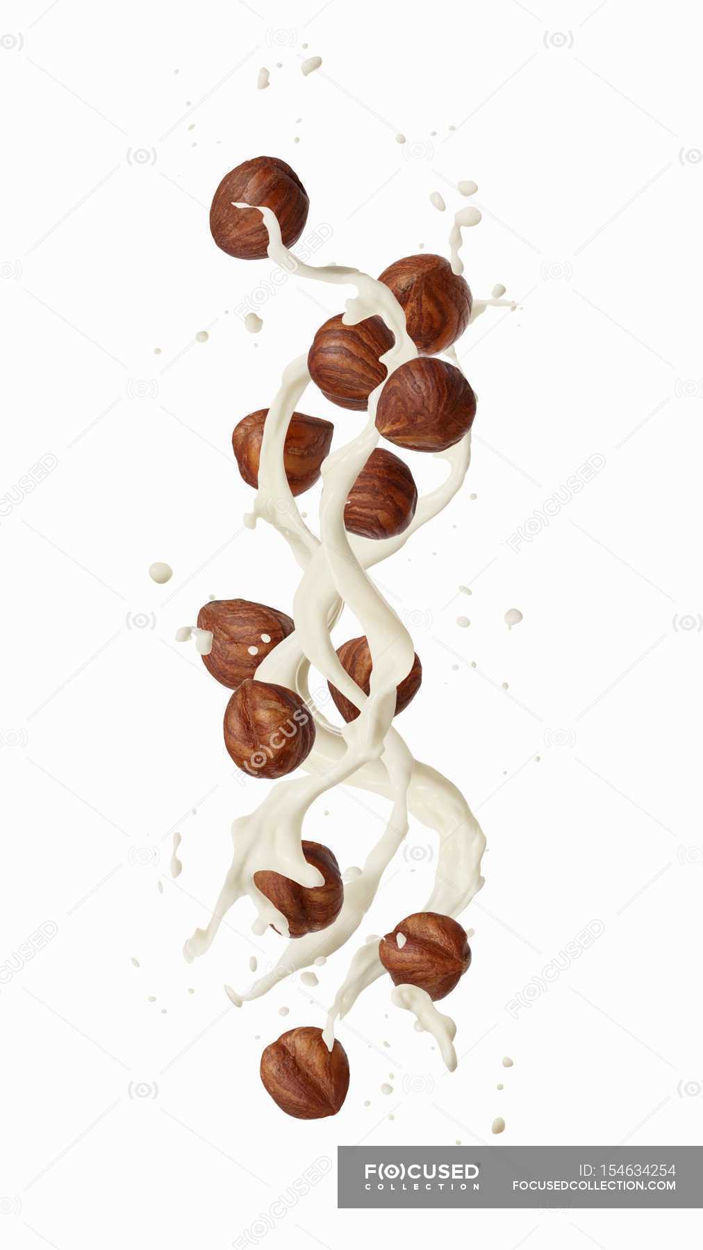Splash of hazelnut milk — portion, diet Stock Photo 154634254