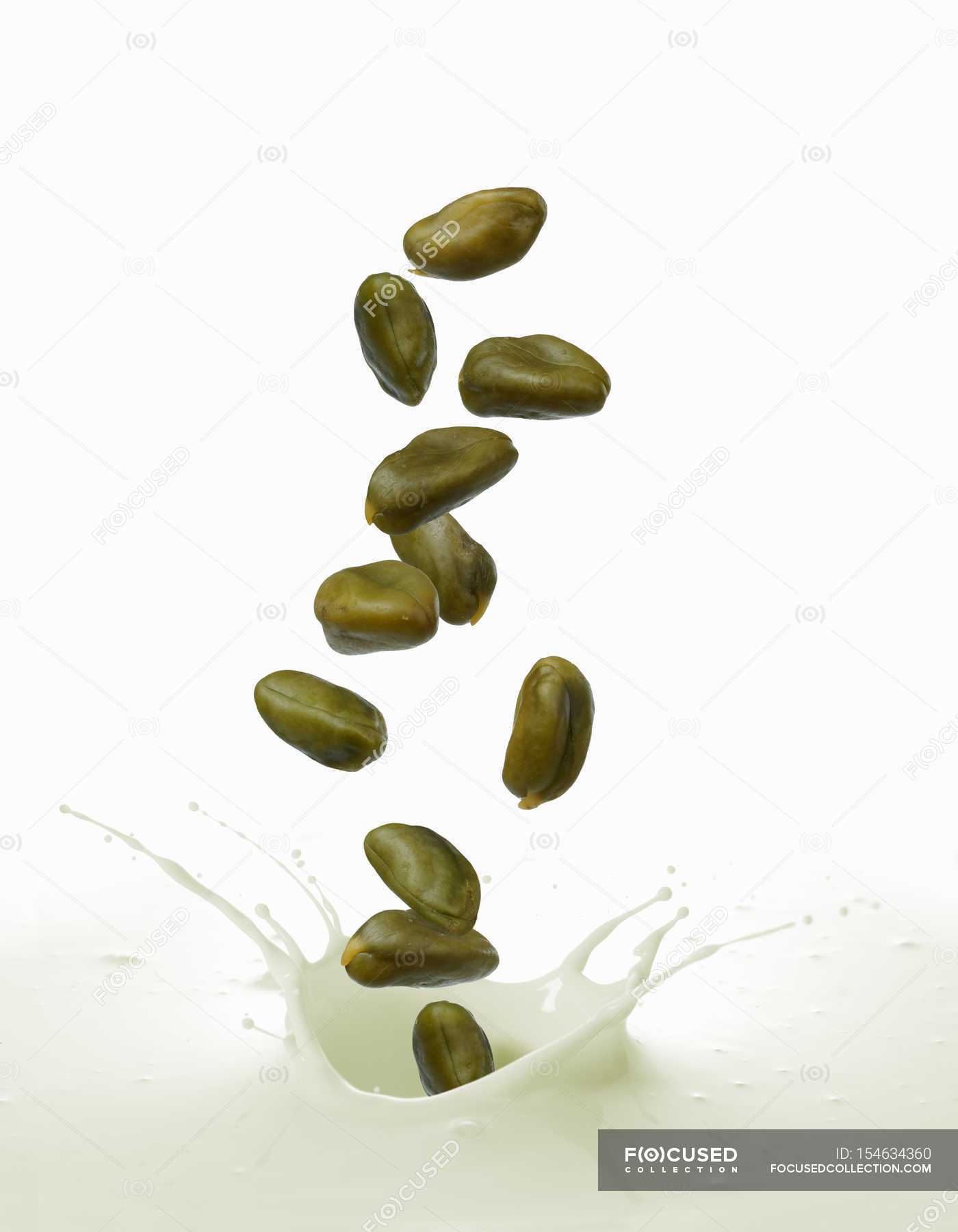 Splash of pistachio milk — cholesterol, weight Stock Photo 154634360
