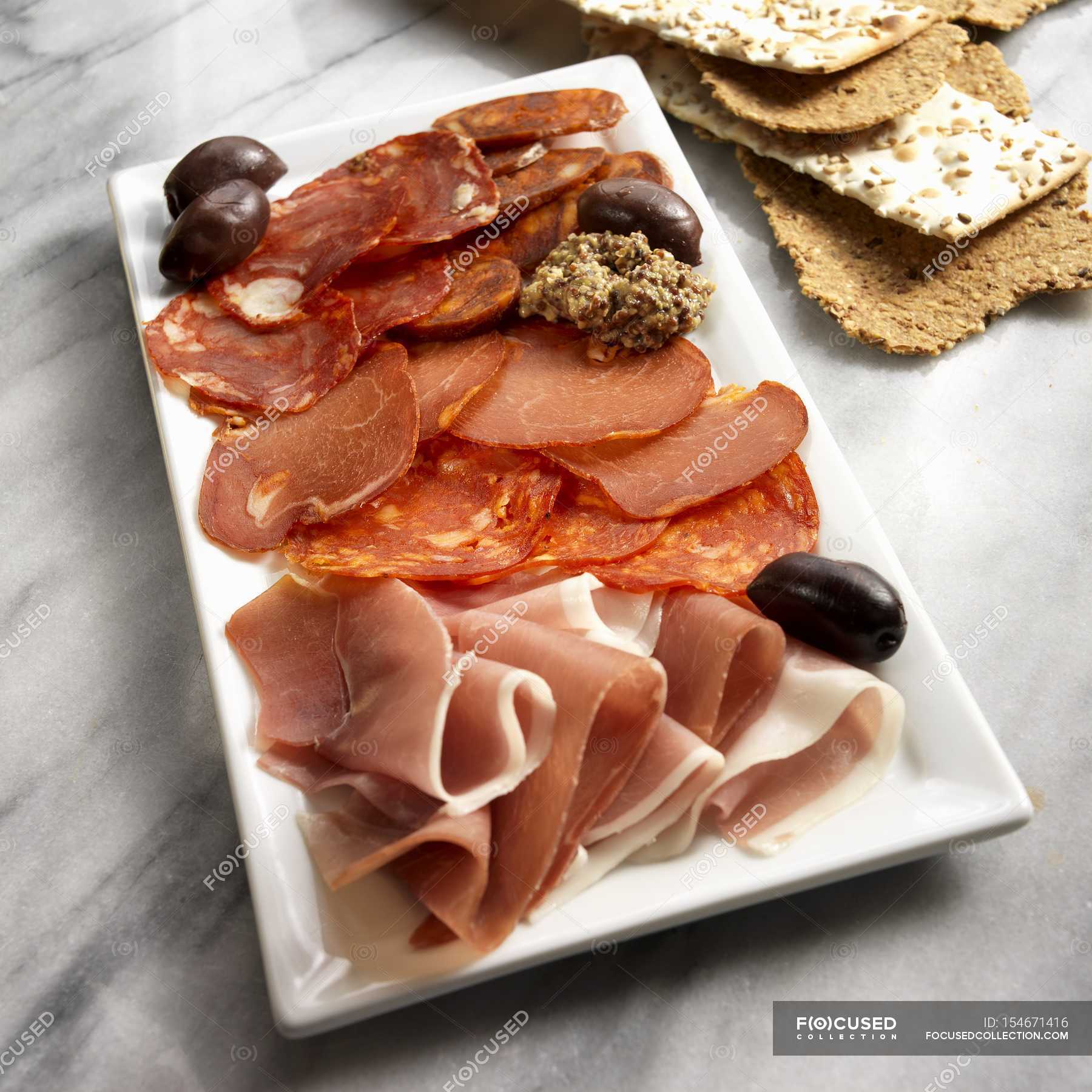 Spanish charcuterie platter — top view, marble Stock Photo 154671416