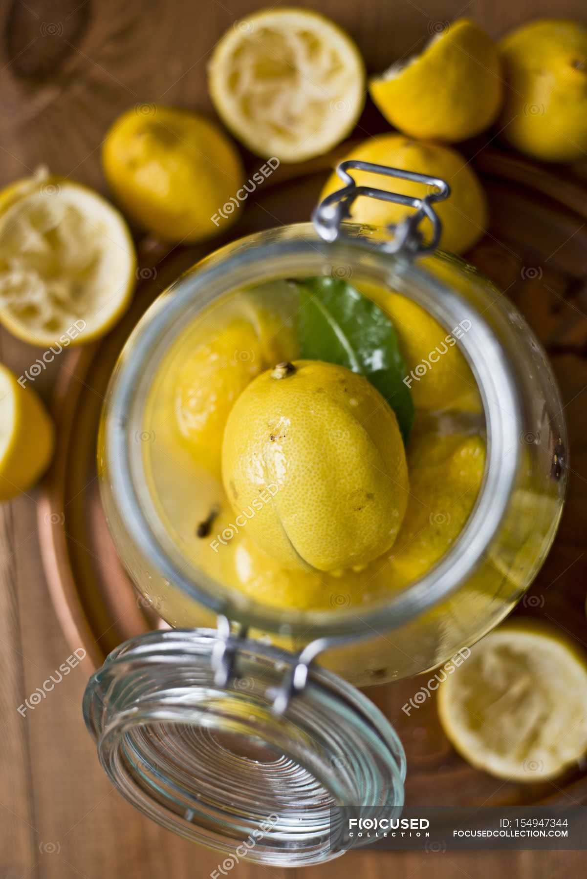 Pickled lemons in jar — cookery, diet Stock Photo 154947344
