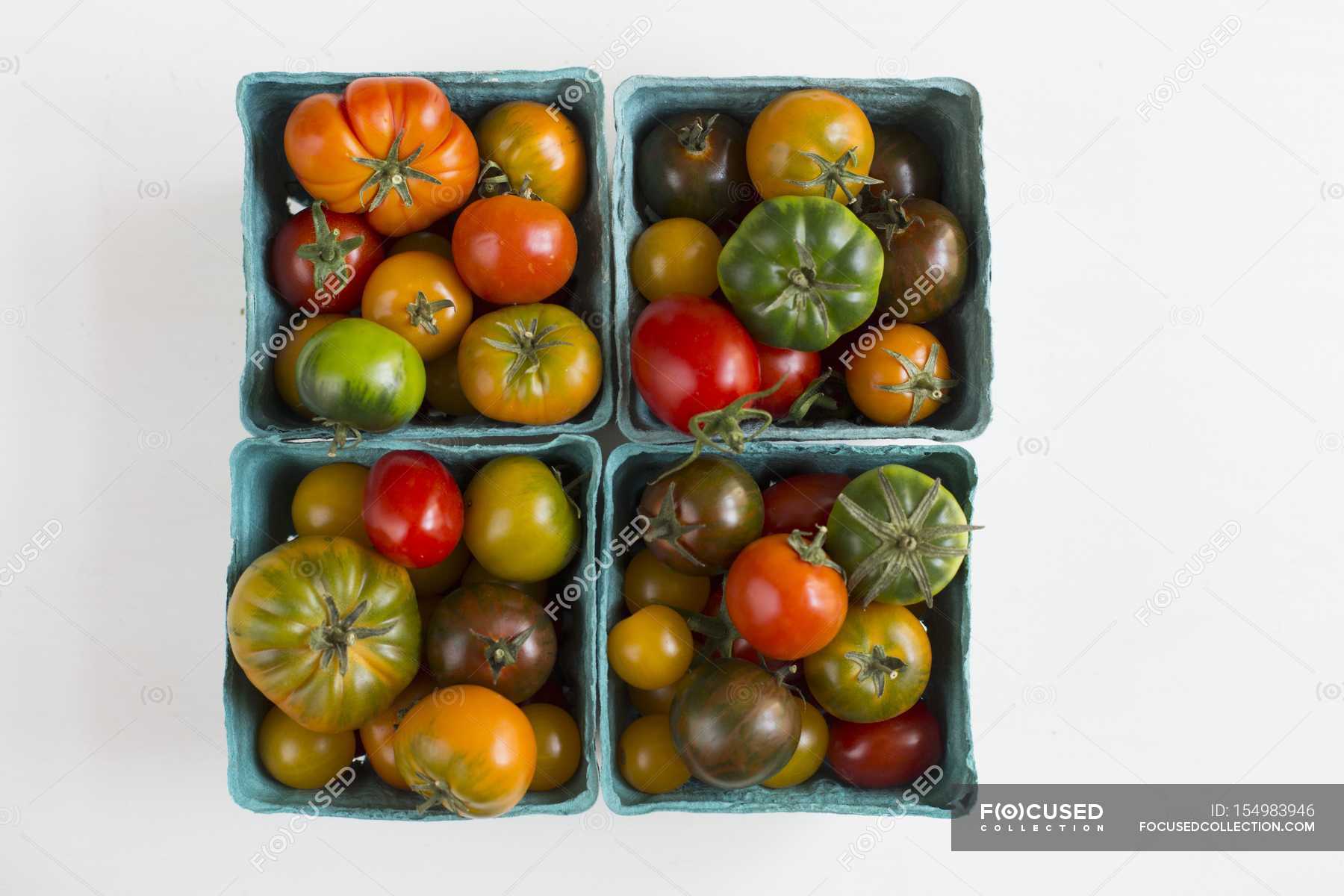 Tomatoes in cardboard punnets — tasty, food - Stock Photo | #154983946