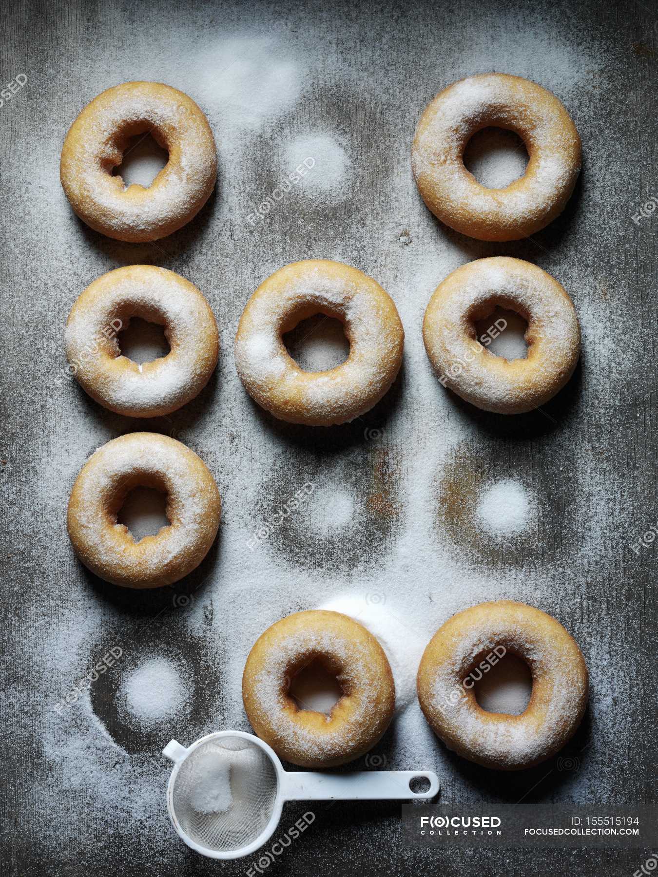 Caramel doughnuts with sugar icing — brown, edible Stock Photo