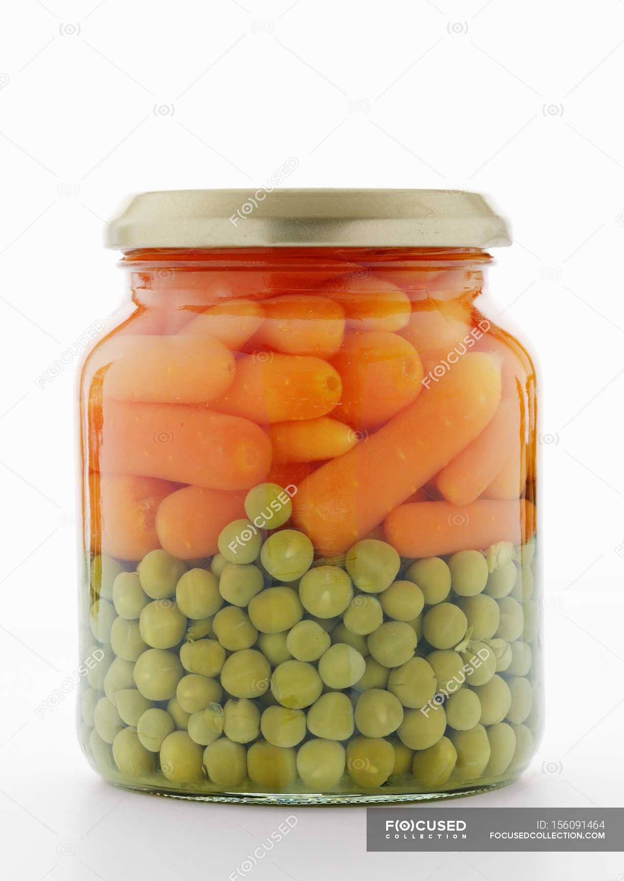 Peas and carrots in jar — fresh, white Stock Photo 156091464