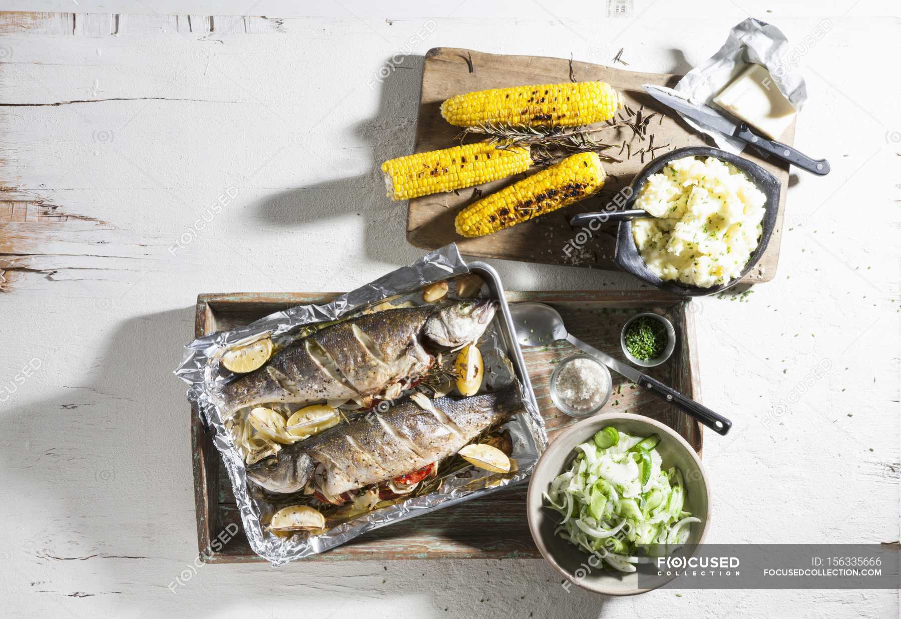 Oven roasted trout with corn — calorie, portion Stock Photo 156335666