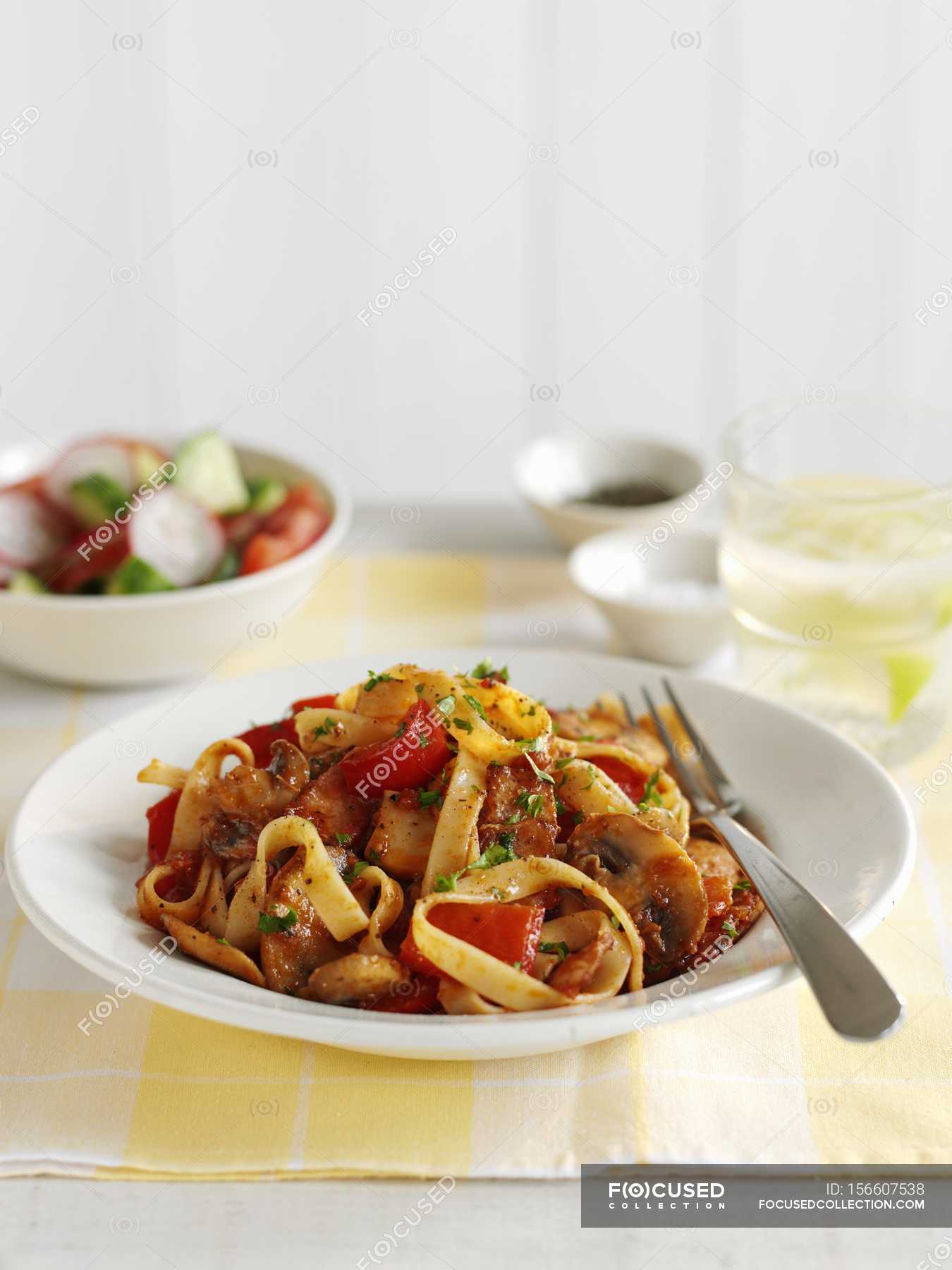 Tagliatelle pasta with bacon and mushrooms — background, food Stock