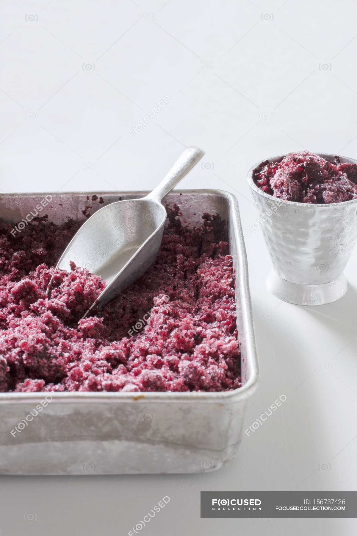 Download Closeup View Of Blueberry Granita In A Metal Tin And A Metal Cup Delicious Nourishment Stock Photo 156737426