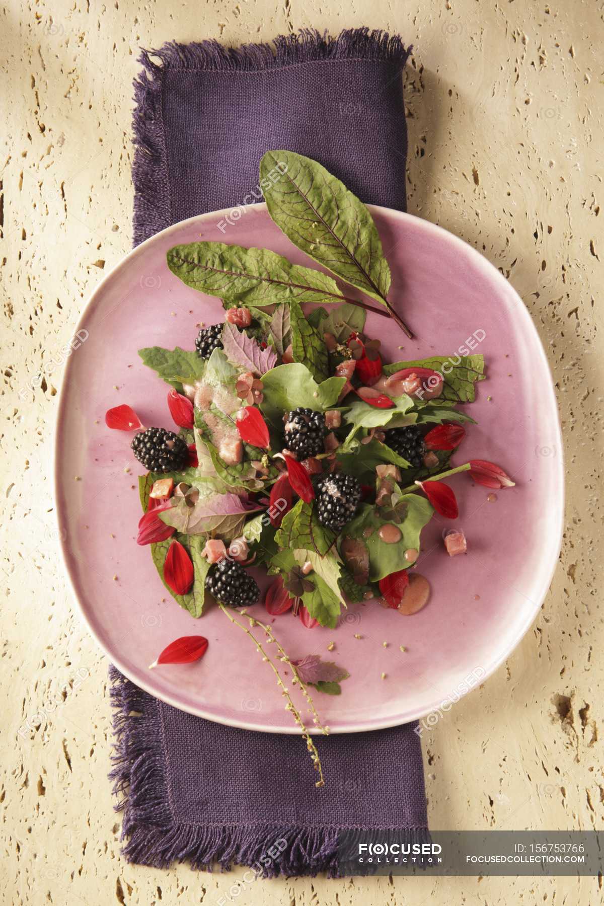 fish-and-chips-with-flower-salad-background-cooking-stock-photo