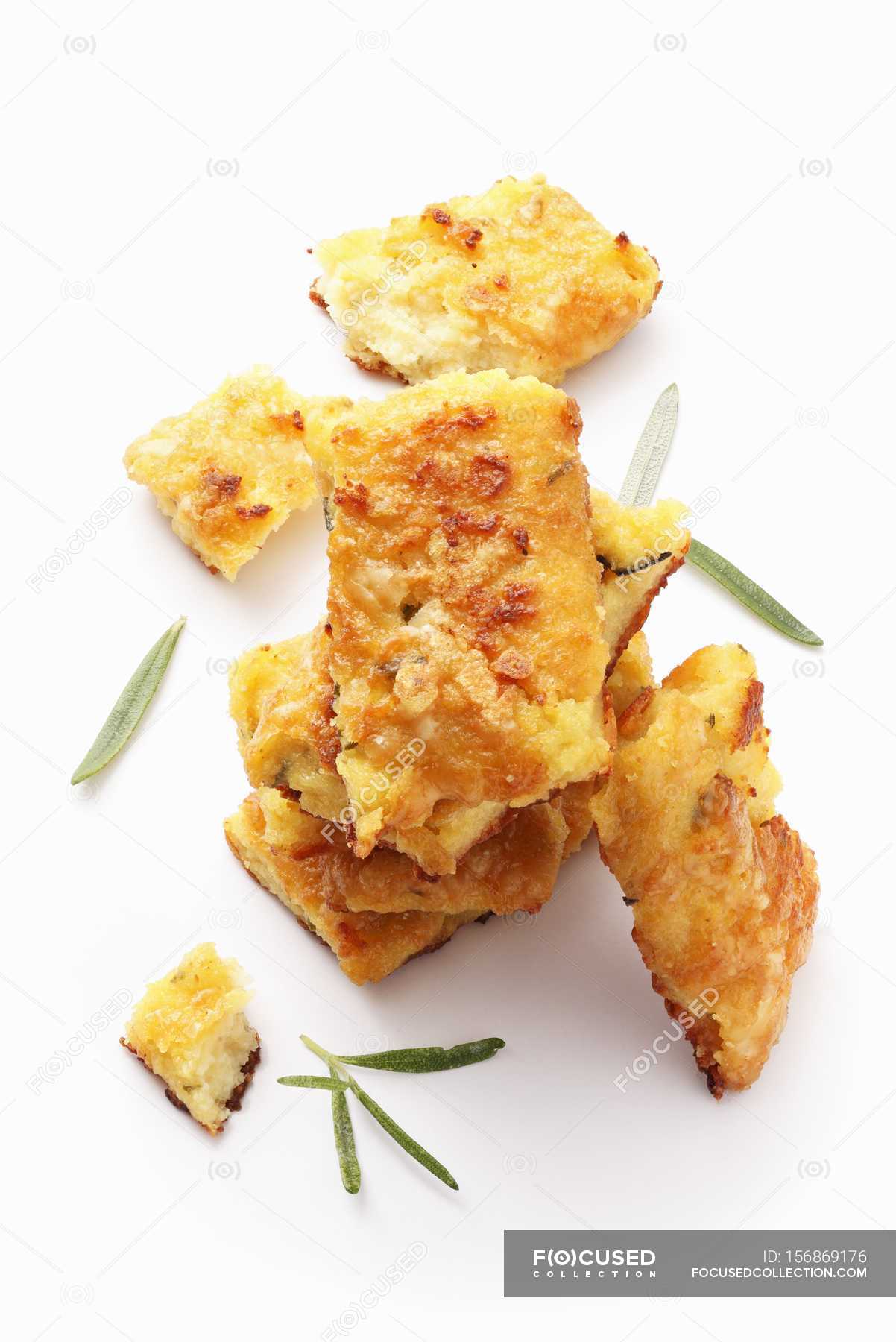 Polenta slices with Parmesan — cooked, tempting - Stock Photo | #156869176