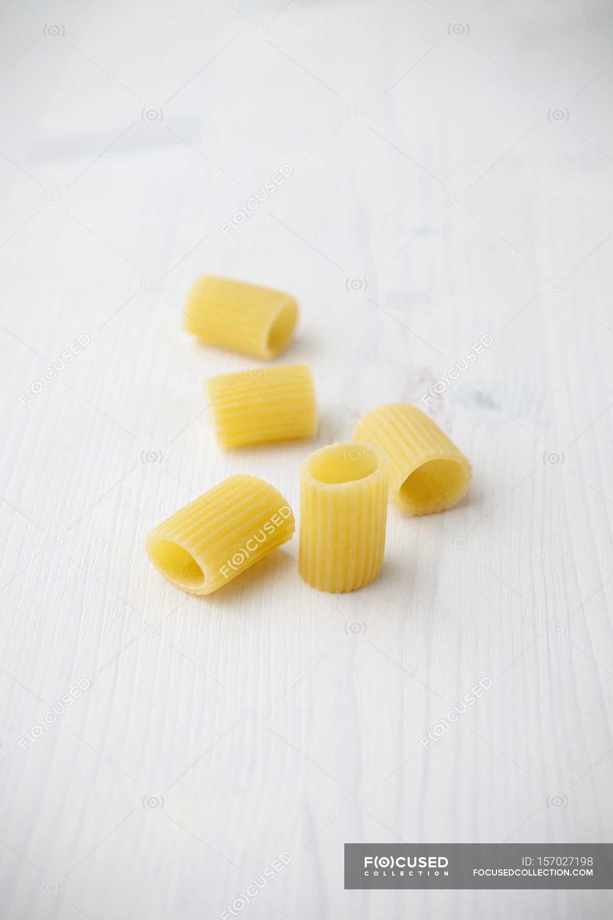 Mezzi rigatoni dry uncooked pasta — edible, nutrition Stock Photo 157027198