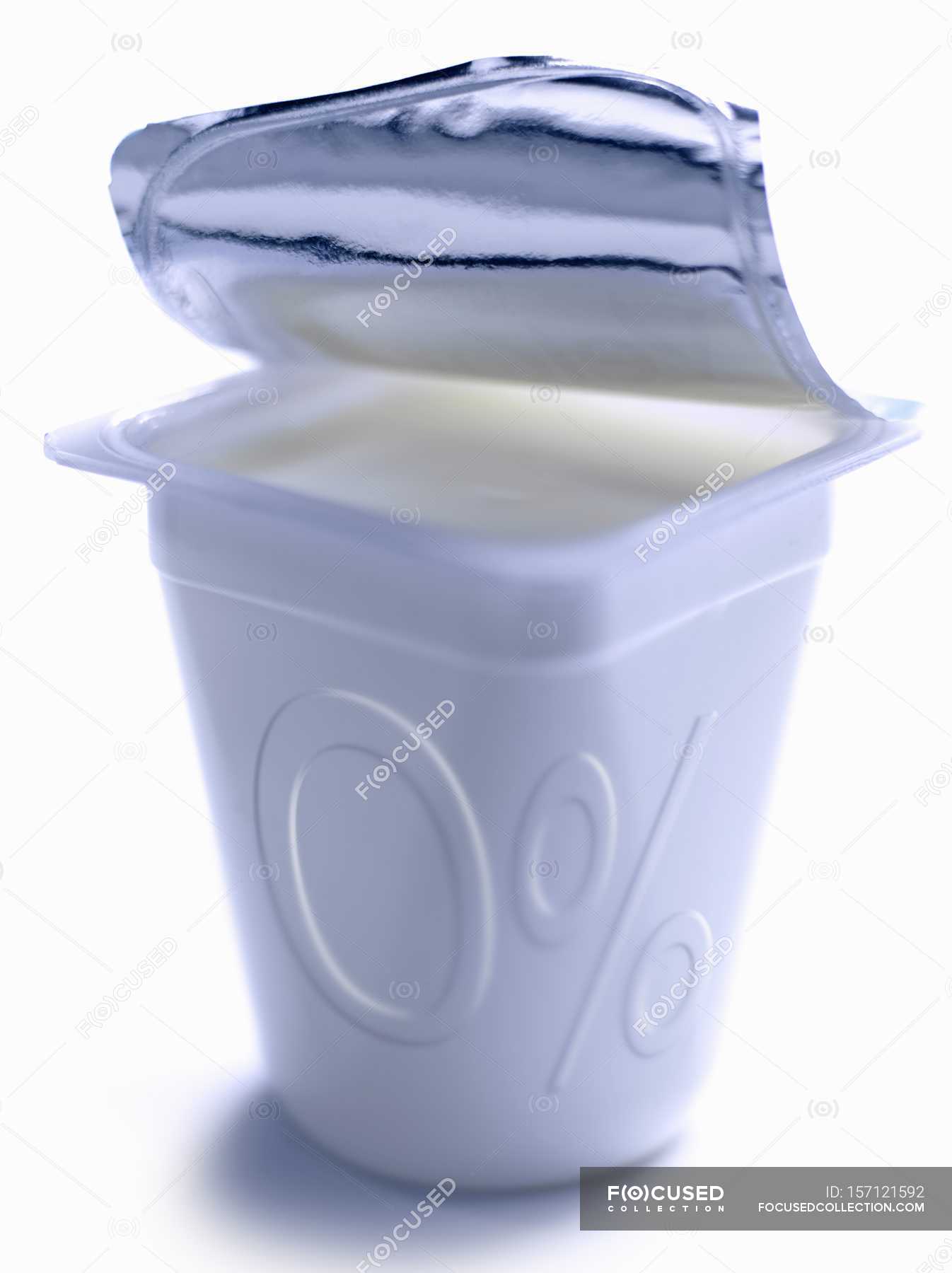 Opened container of plain yoghurt with zero percent fats — delicious