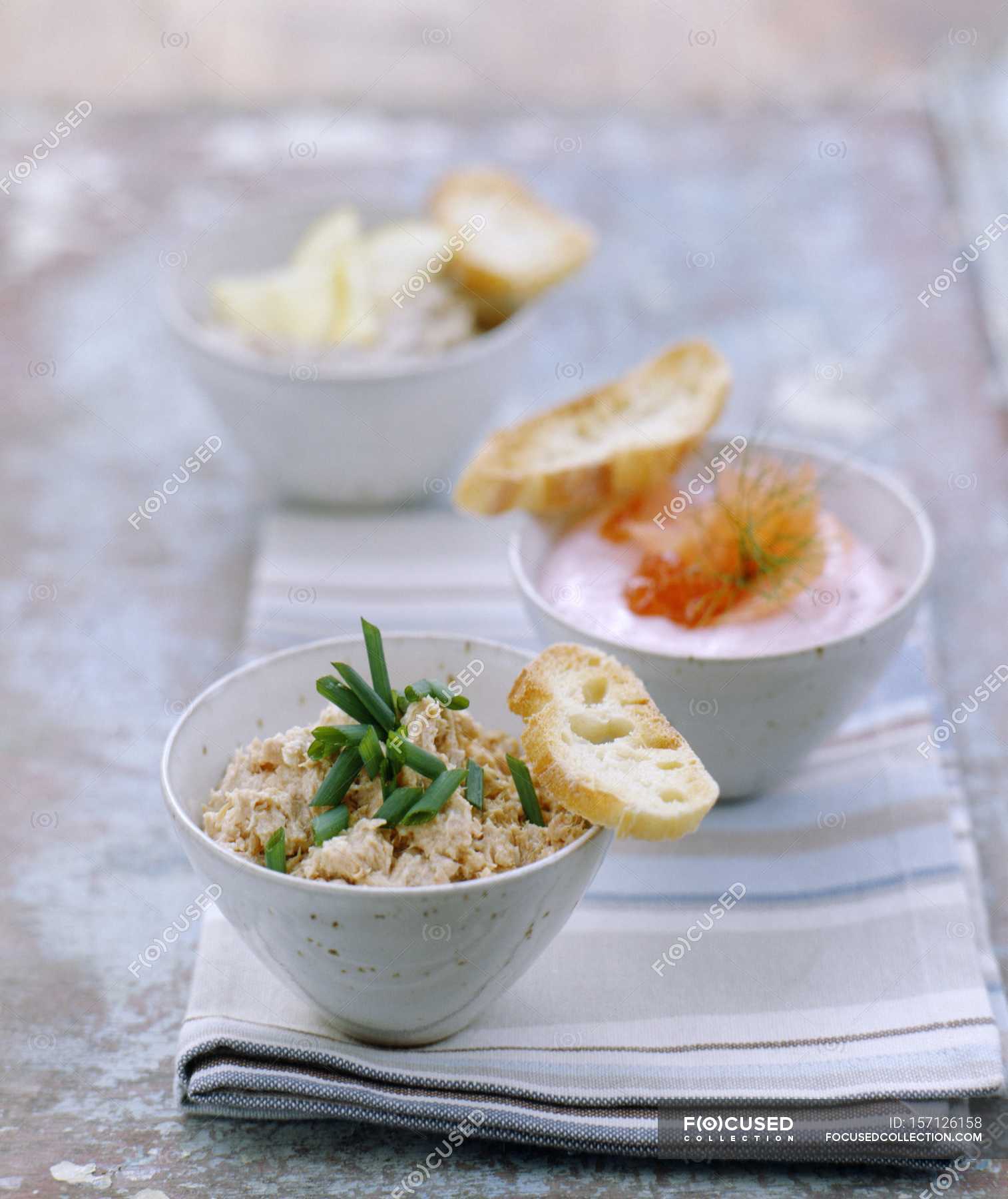 Closeup View Of Tuna Fish Pate With Chives And Taramasalata With Fish Backdrop Background Stock Photo