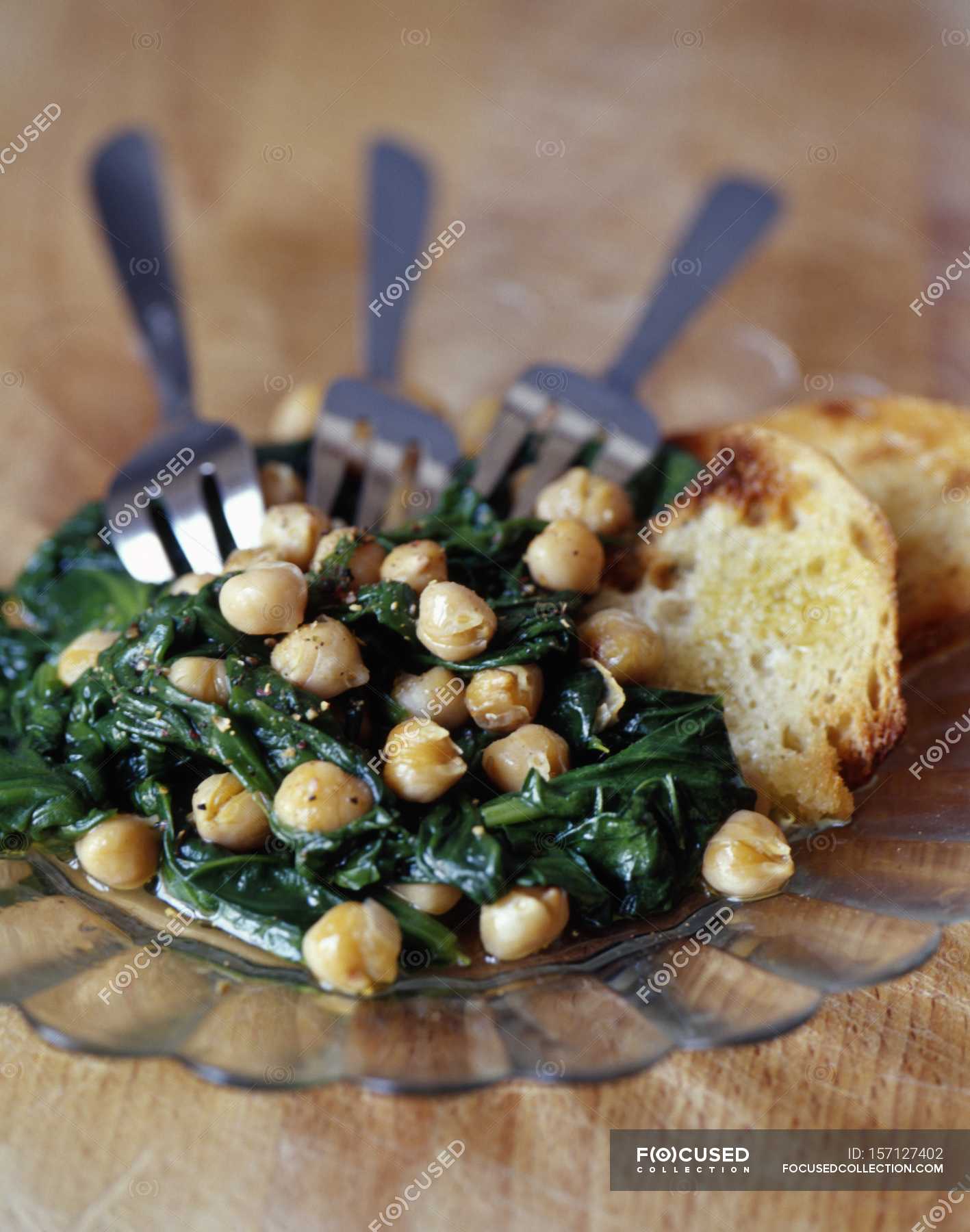 Panfried spinach — oil, over Stock Photo 157127402