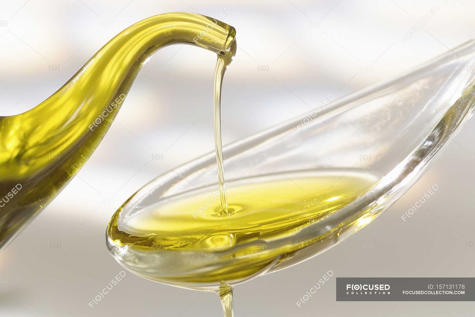 Dash of olive oil — salad dressing, dip net Stock Photo 157131178