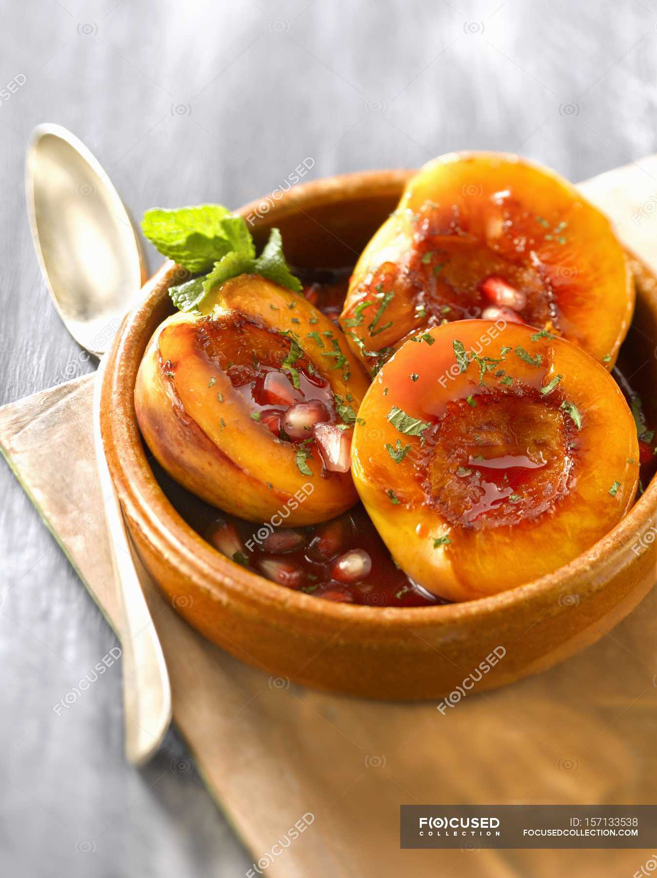 Nectarines roasted in syrup — cooking, cheese Stock Photo 157133538