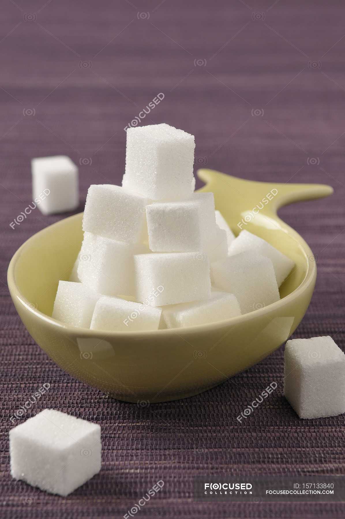 Bowl of white sugar lumps — edible, sweet Stock Photo 157133840