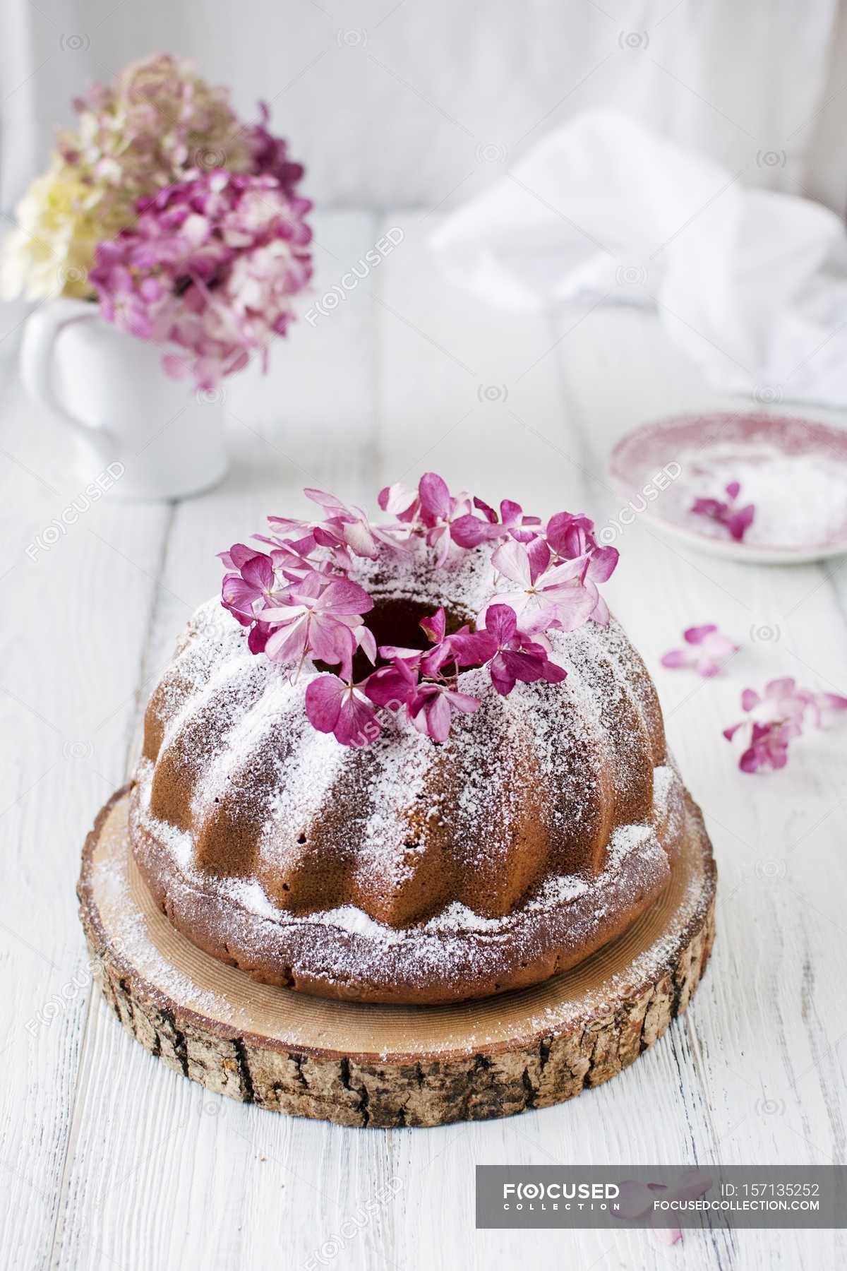 decorating a bundt cake with flowers