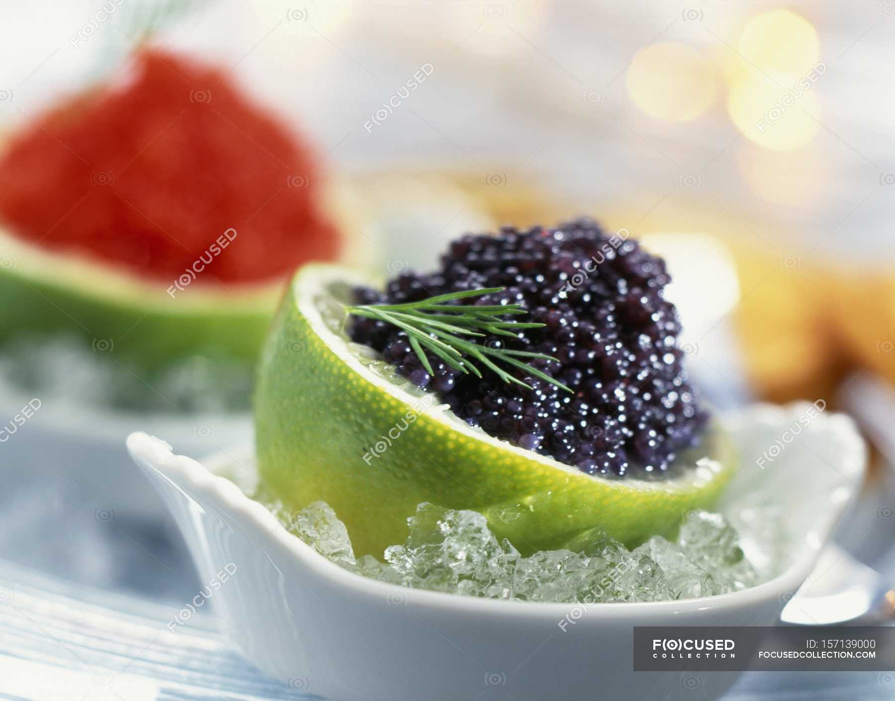 closeup-view-of-lime-filled-with-lumpfish-roe-dill-diet-stock