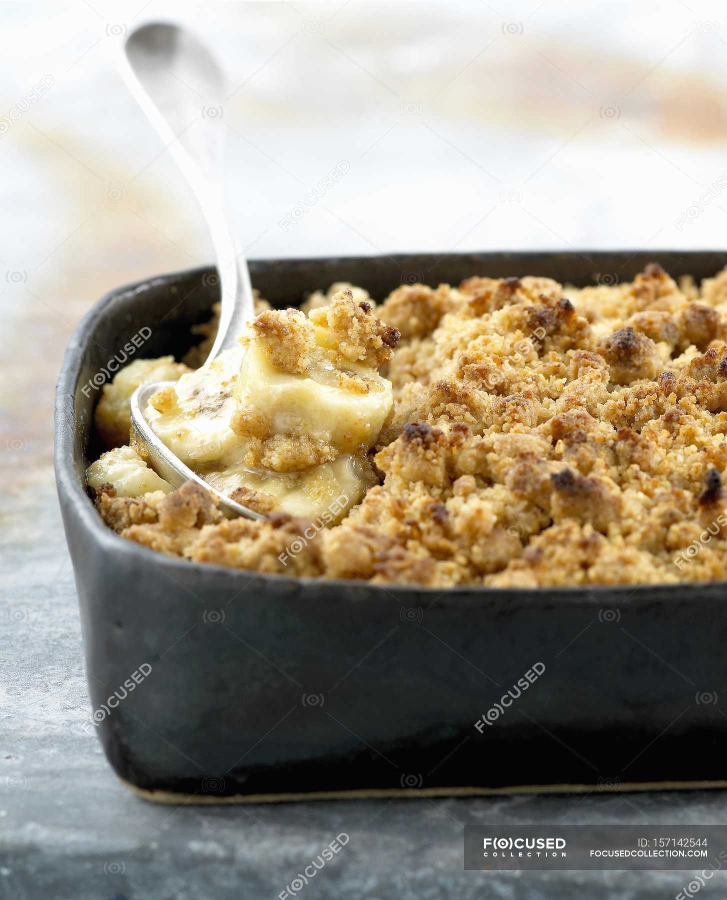 Banana crumble in tray — antioxidants, backdrop - Stock Photo | #157142544