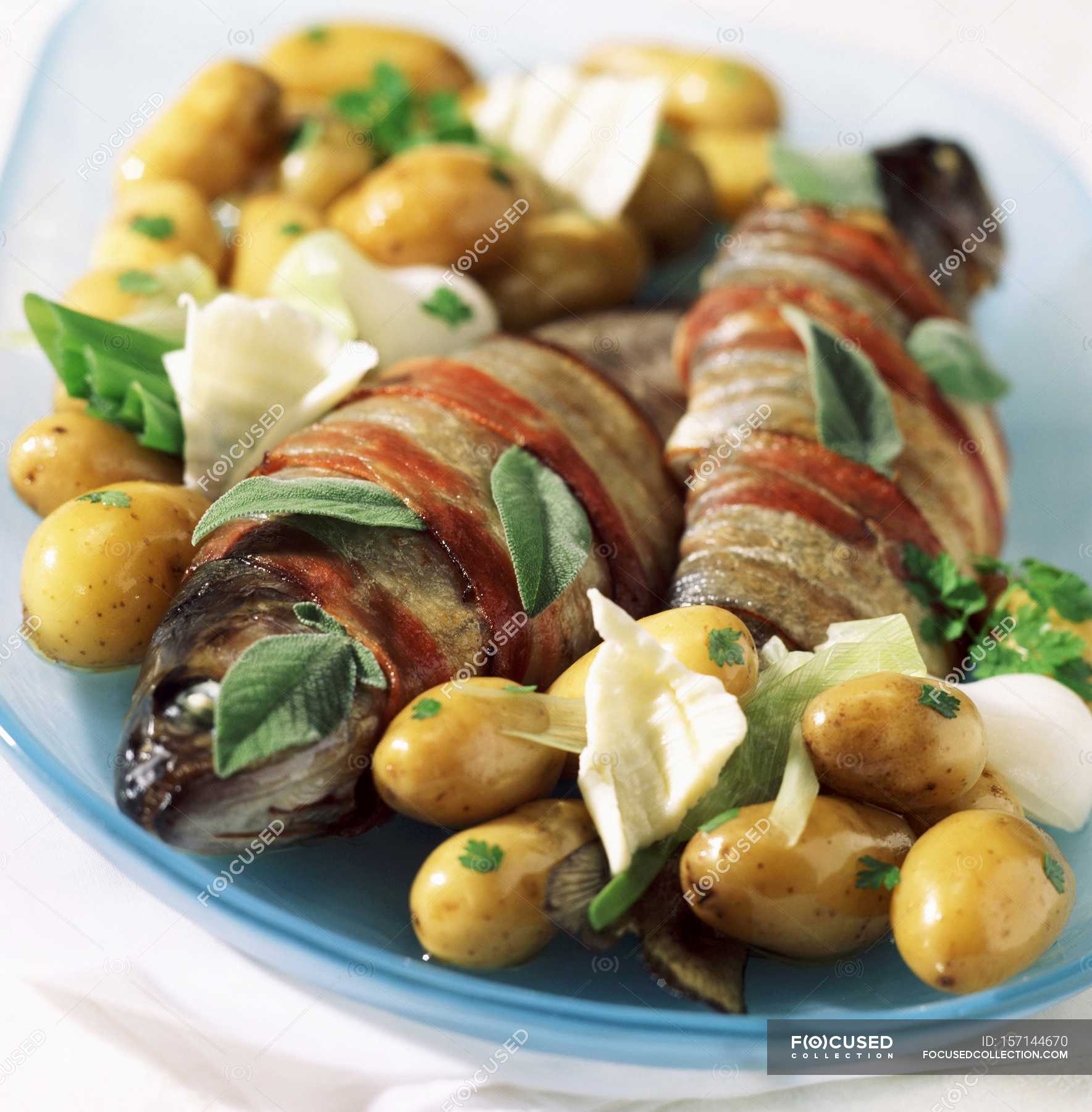 Trout wrapped in bacon — color, appetizing Stock Photo 157144670