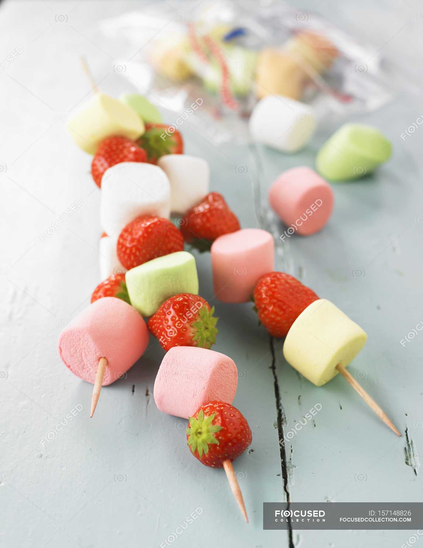 Colorful Marshmallow Skewers On Wooden Background Stock Photo, Picture