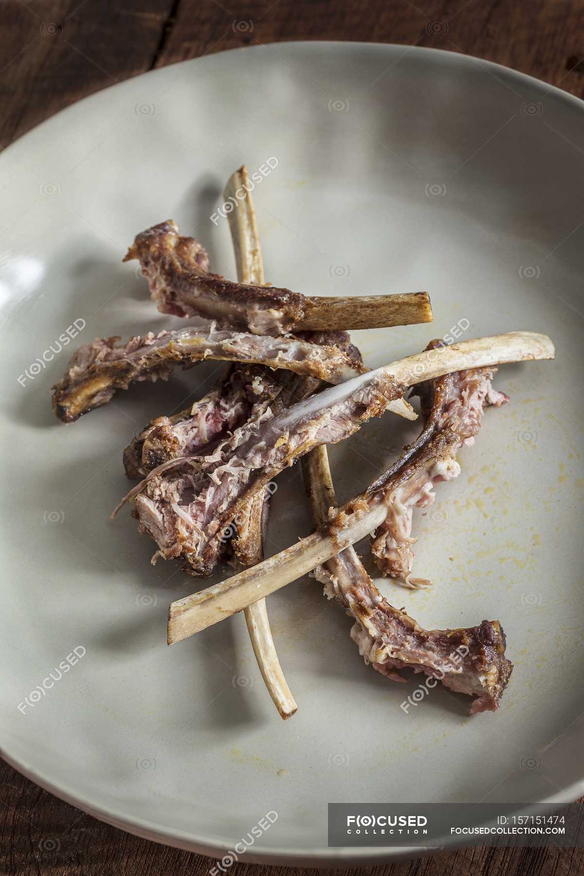 Lamb Rack bones — lamb chops, gnawed Stock Photo 157151474