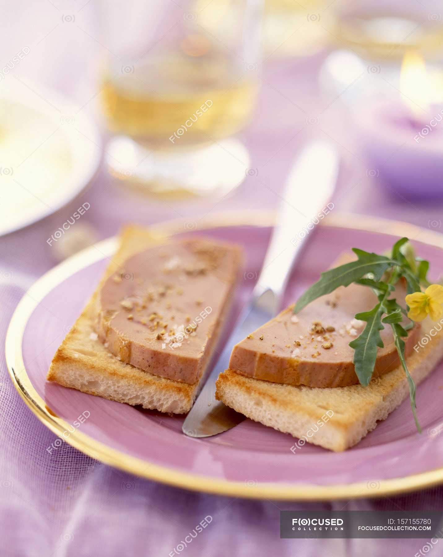 Foie gras on toast — portion, seasoned Stock Photo 157155780