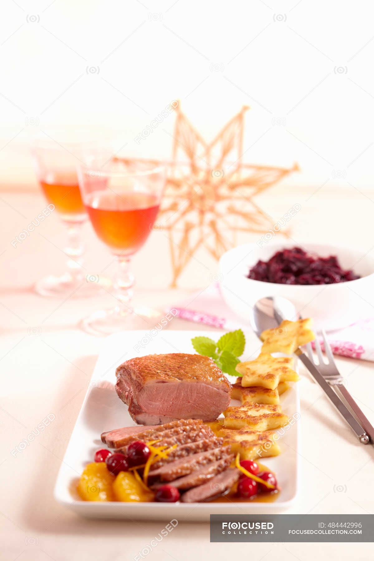 Rare duck breast with a fruity orange and cranberry sauce, fried potato